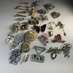 BIG LOT OF VINTAGE COSTUME BROOCHES AND PINS: 32 piece lot of vintage costume brooches, tie clips and pins.