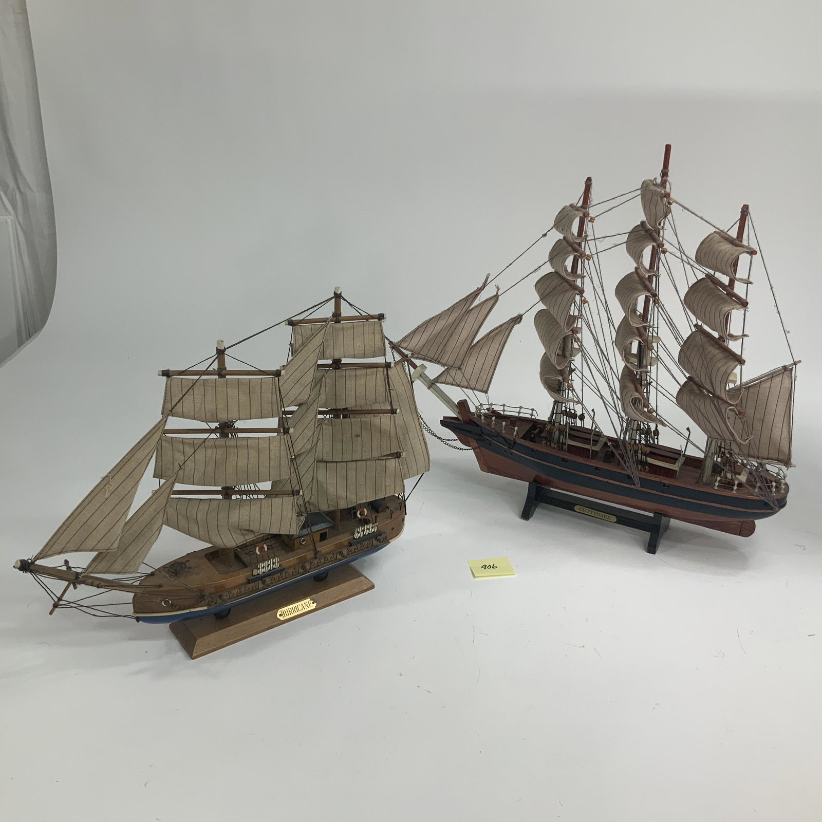 Lot of 2 Sailing Ship Models: Lot of 2 wooden sailing ship models with rigid sails. Largest is approx. 24 inches long. See pictures