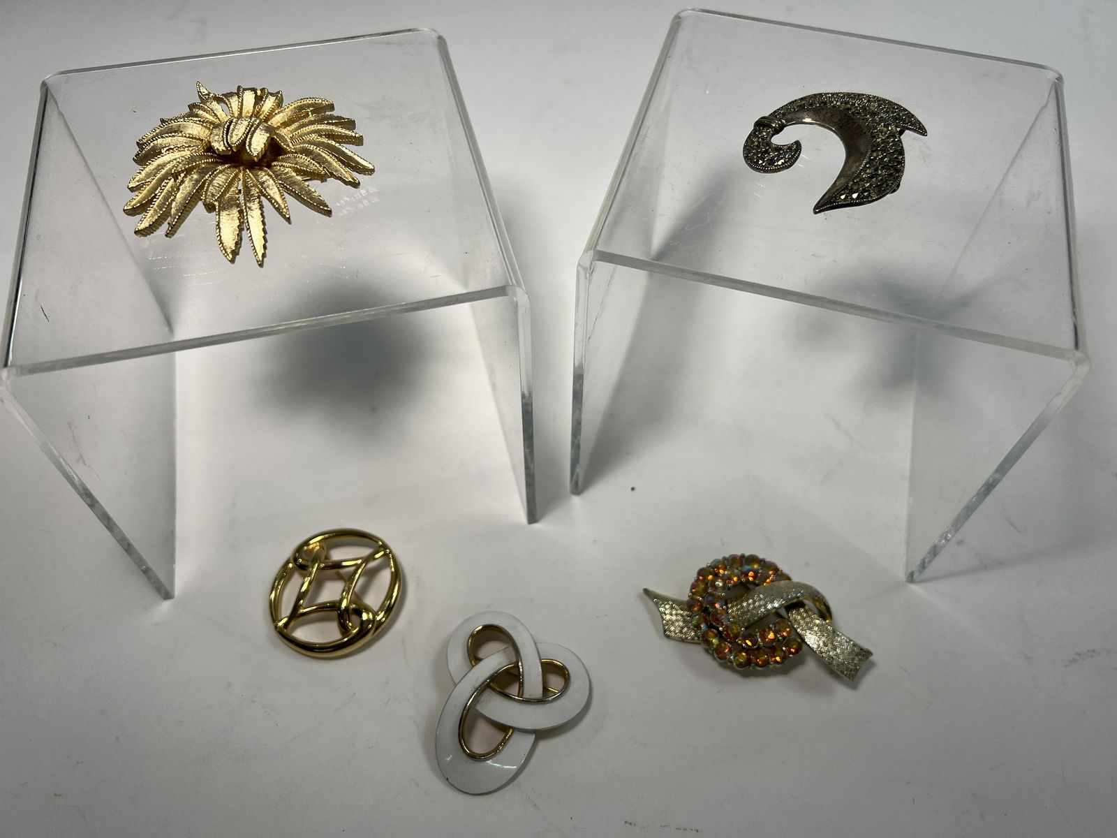 Lot of 5 Brooches- Trifari, Monet, and more: Gold tone costume jewelry Trifari, Monet, Sterling. Very good Vintage Condition See photo
