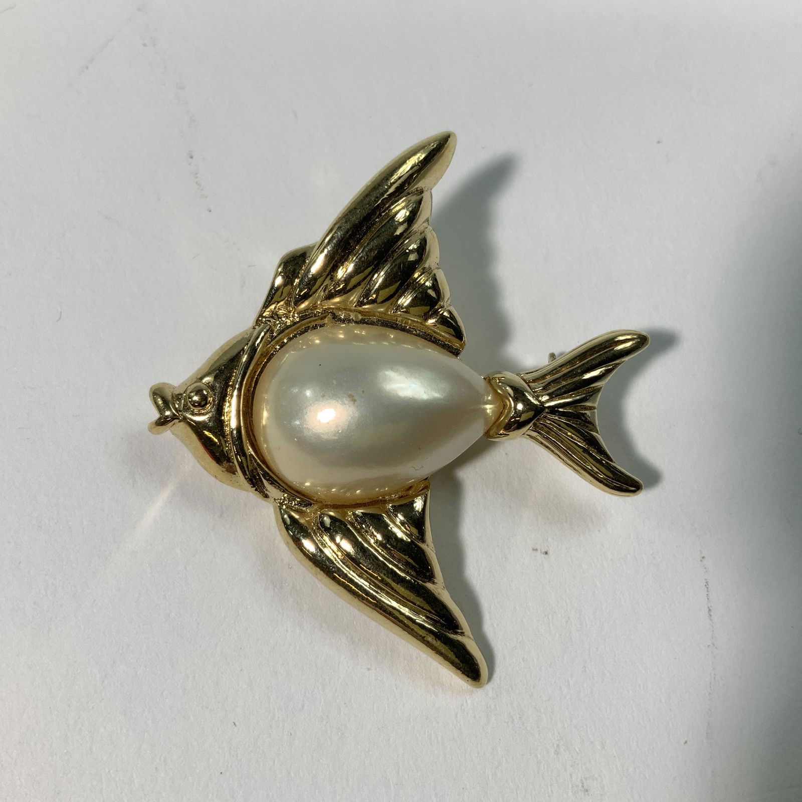 Trifari Fish Brooch with pearl body: Marked Trifari. Measures 1.5 inch
