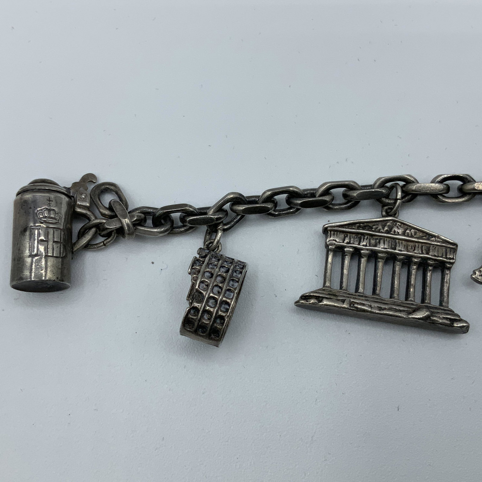 Sterling Charm Bracelet with 8 Sterling Charms: 48 gm Measures 6 in, Beer Stein, Bull Fighter, Eiffel Tower, Berlin, travel