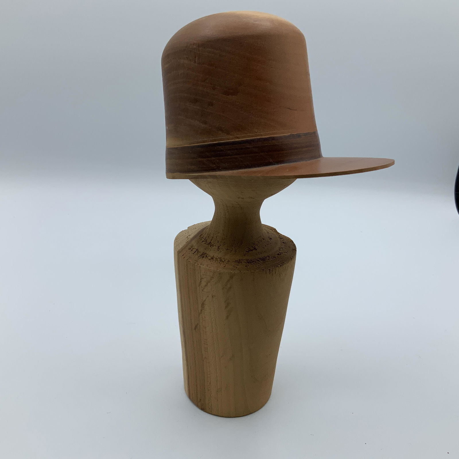 Artisan Turned Billed Cap on Stand: Artisan Turned Billed Cap on Stand. Cap is approx. 3" X 4 1/2", stand is approx. 8" tall.