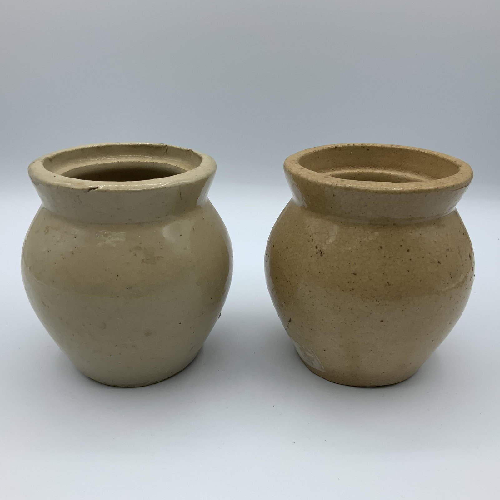 Roycroft Honey Pots: Pair of tan 4" Roycroft honey pots, with impressed "Roycroft Shops, East Aurora, NY SYU." RC-12, RC-13