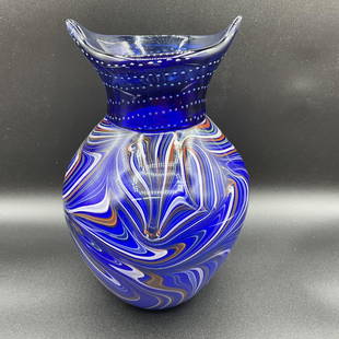 Murano Glass Vase: Murano blue glass vase with multi color swirled pattern. Approx. 10 1/2" tall and 6 1/2" in diameter.