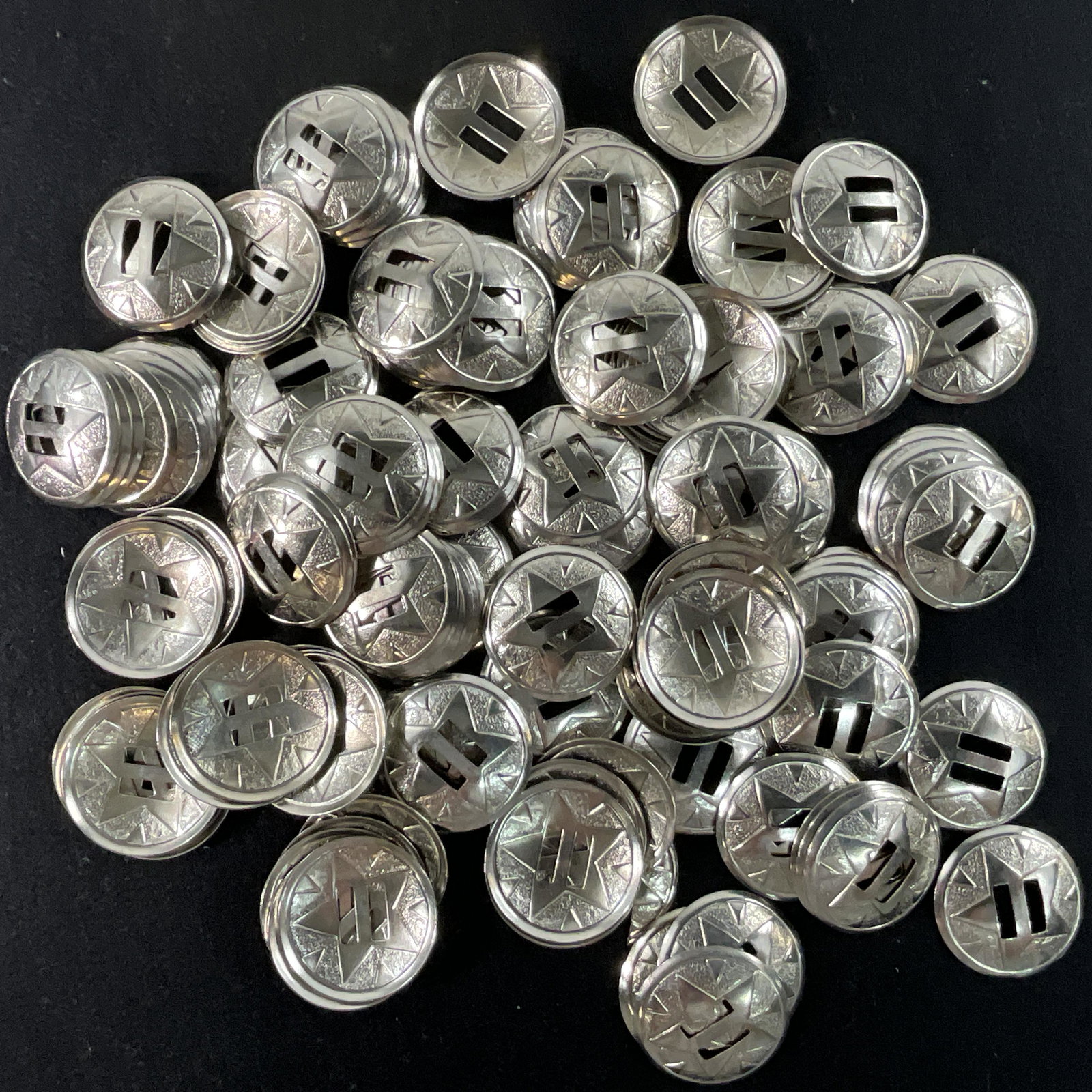 Steel Conchos: Large lot of steel conchos for jewelry, belt, or holster making. Conchos are approx. 1 1/2" in diameter. We didn't count them, but they weigh 1 Lb, 15 Oz.