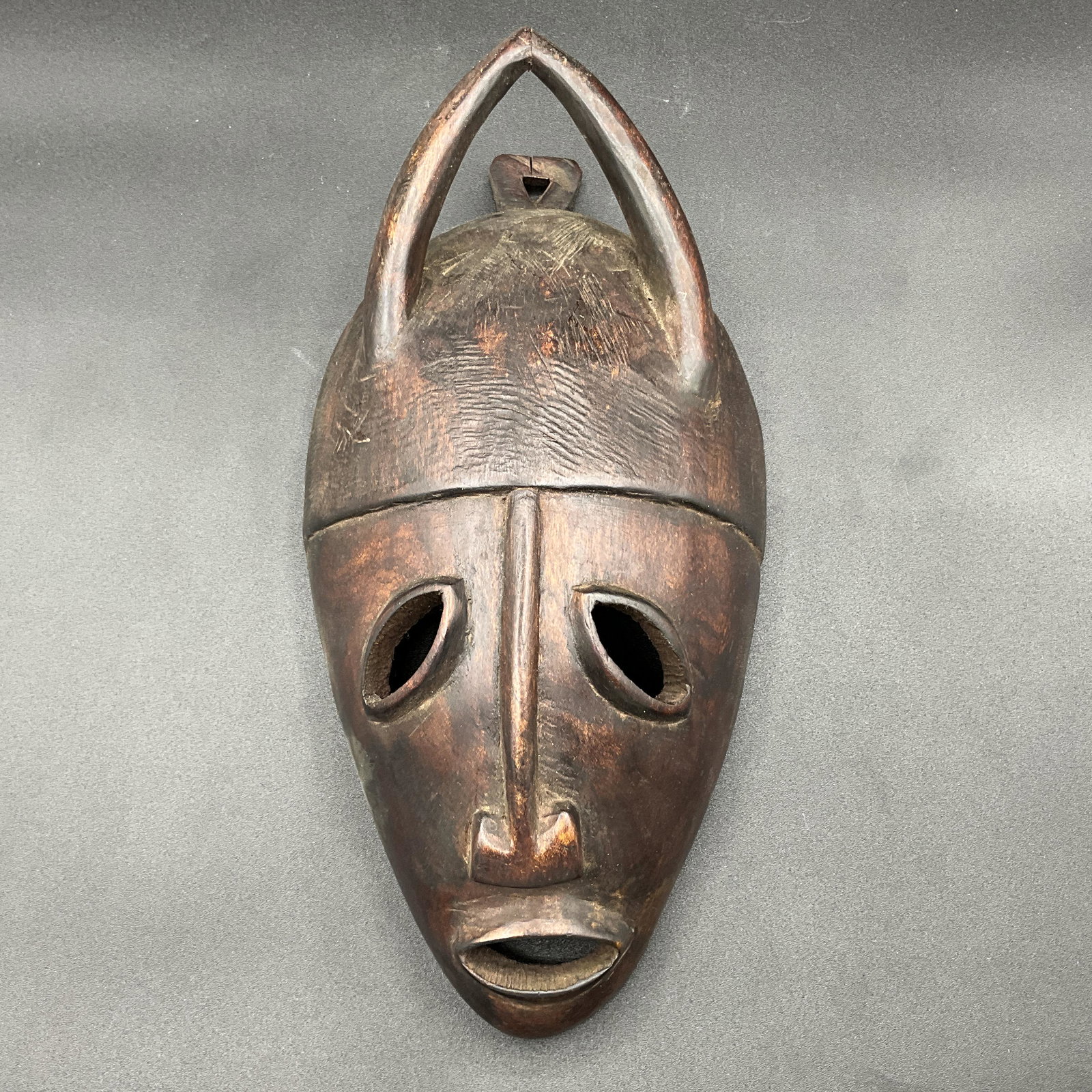 African Carved Mask: African Carved Mask. Measures approx. 6.25" x 13" x 3"
