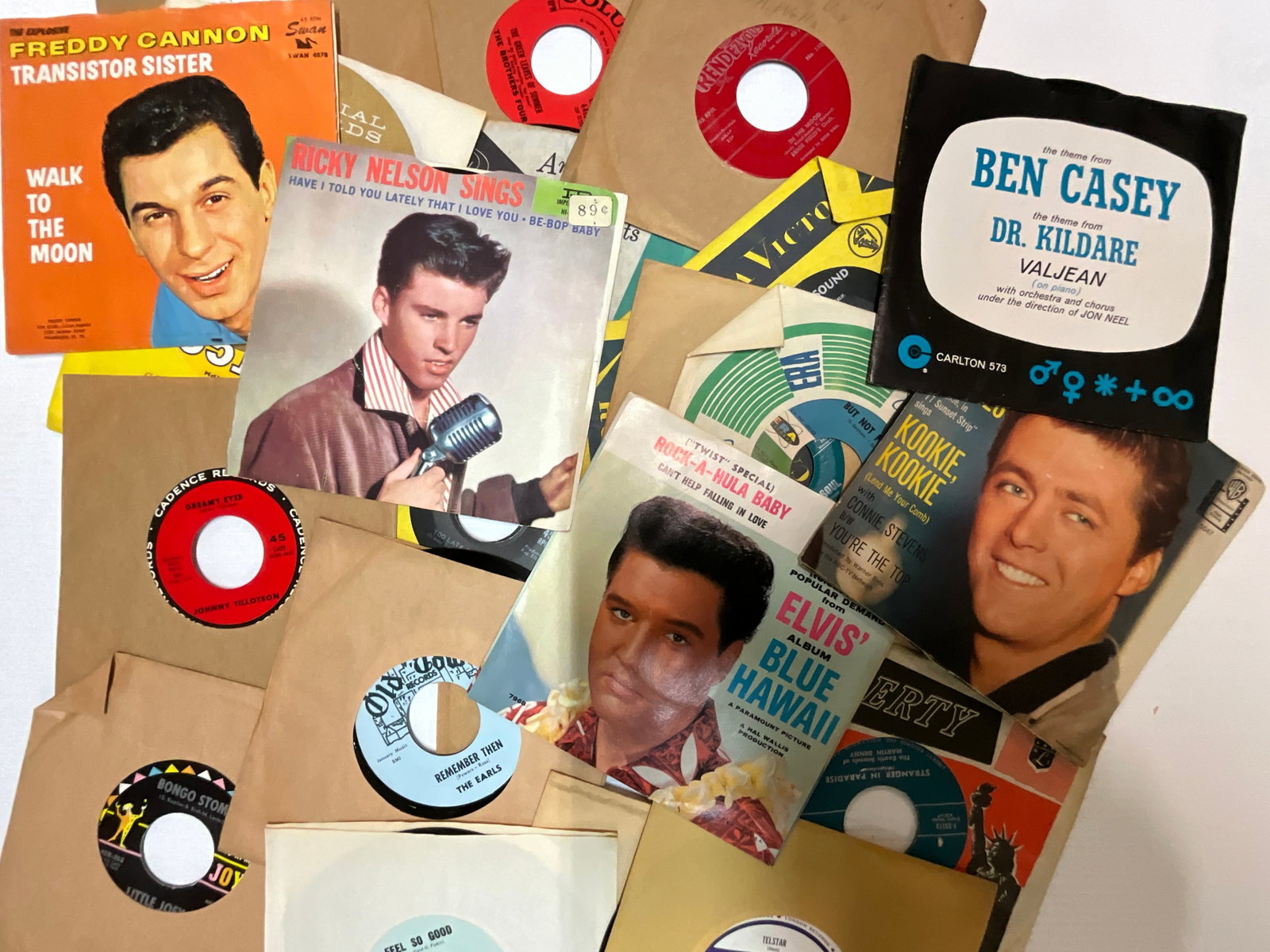 Classic 45 RPM Records: Group of 25 classic 45 RPM records, including Elvis (I Can't Help Falling in Love), Ed Byrnes (Kookie, Kookie, Lend me Your Comb), Rickey Nelson (Have I Told You Lately), Paul Revere & The Raiders (Sh