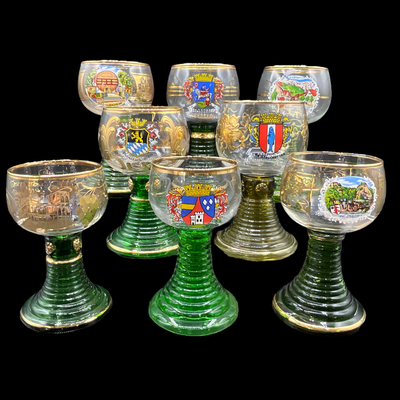 German Wine Glasses: Lot of 8 souvenir German wine glasses from different German locales. Various sizes, ranging from 4.75" to 7" tall.