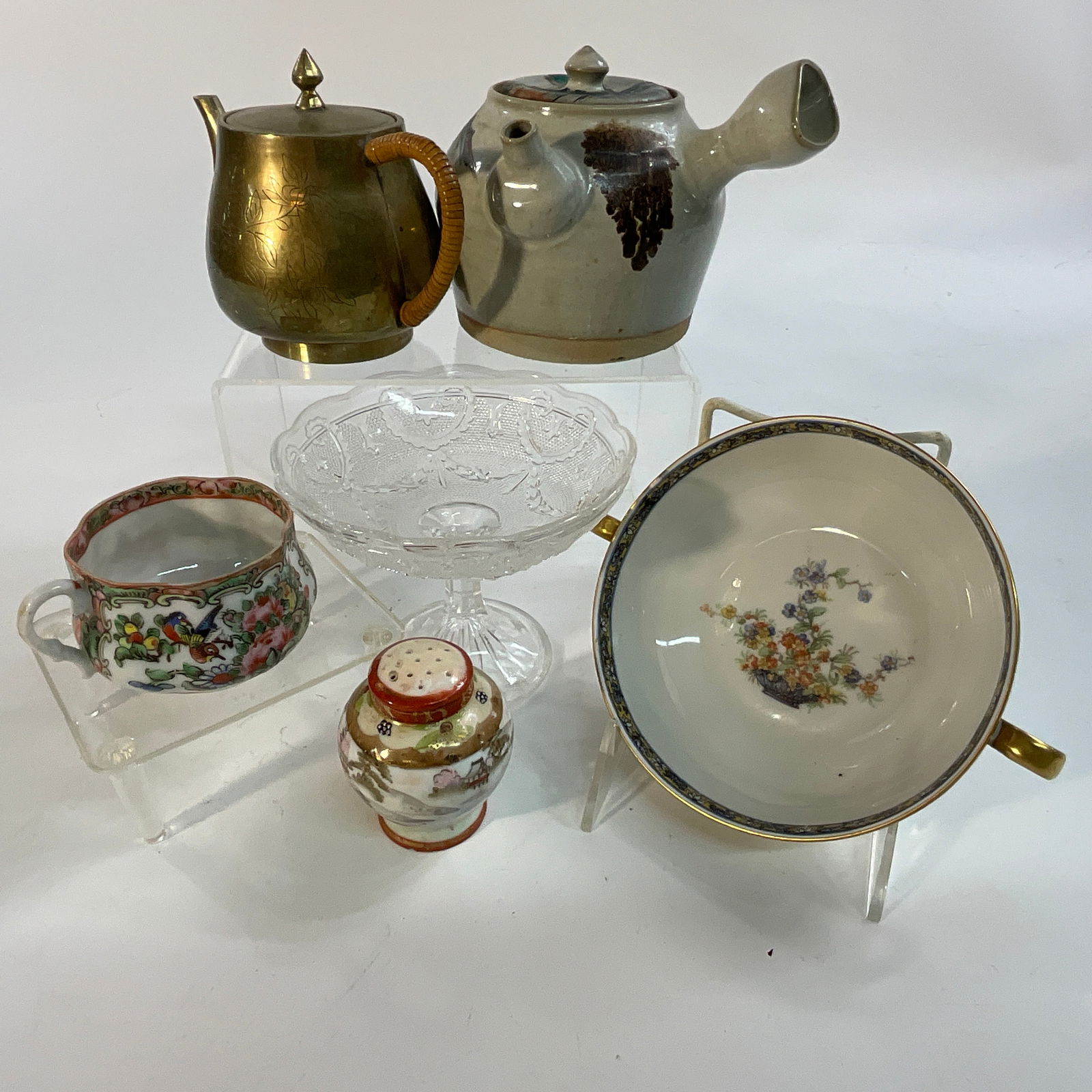 Teapots, Porcelain: A ceramic teapot, approx. 4.5" in diameter, and a 3" diameter brass teapot. A Chinese porcelain teacup, a 5.25" diameter Haviland Limoges 2 handled dish, a small pattern glass compote, approx. 5" in d
