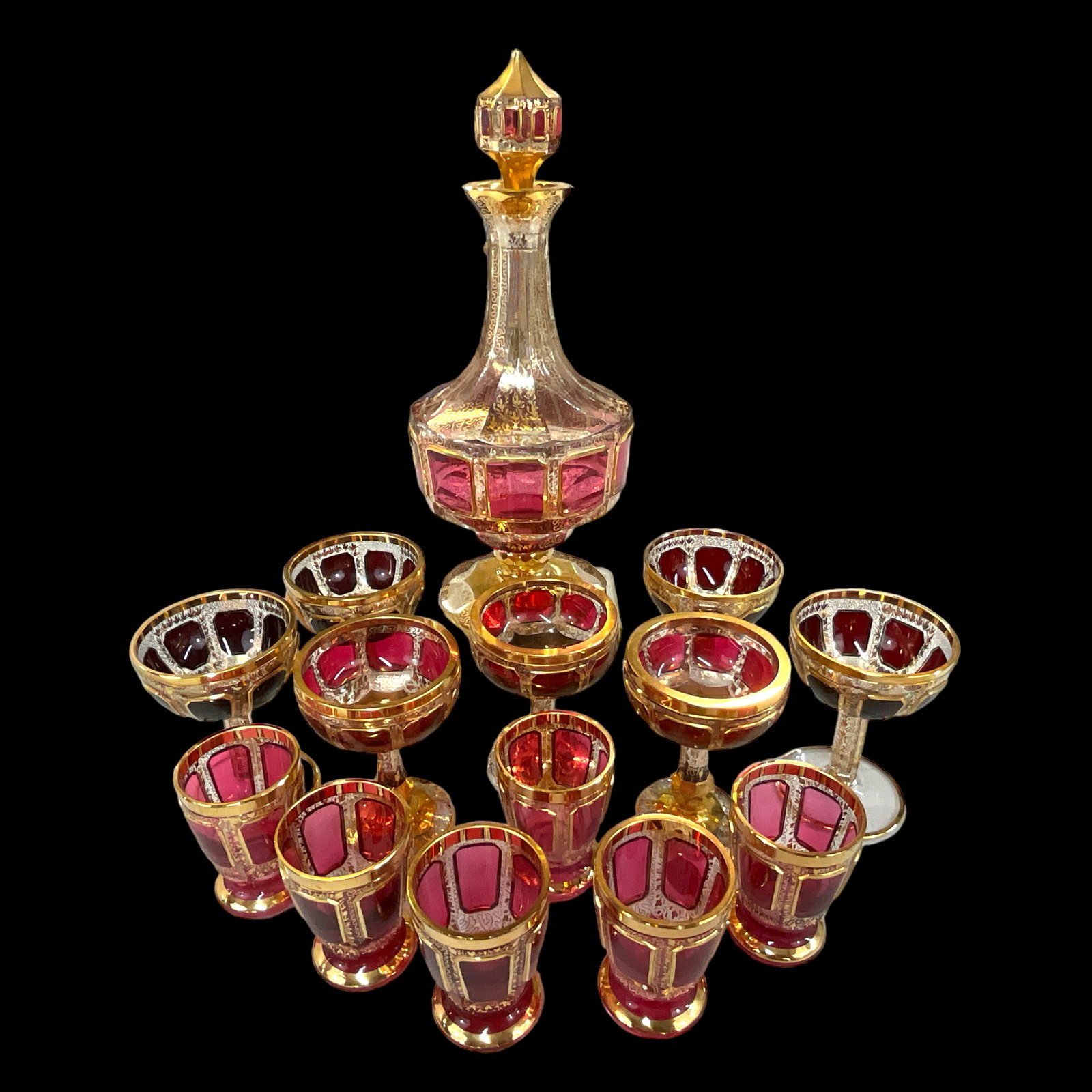 Moser (Attributed)"Cabochon" Decanter with Assorted Glasses: "Cabochon" Decanter with Assorted Glasses (6, 3" schnapps glasses; 4, 4" port wine glasses; 3 champagne glasses). Decanter is approximately 12" tall. Attributed to Moser.