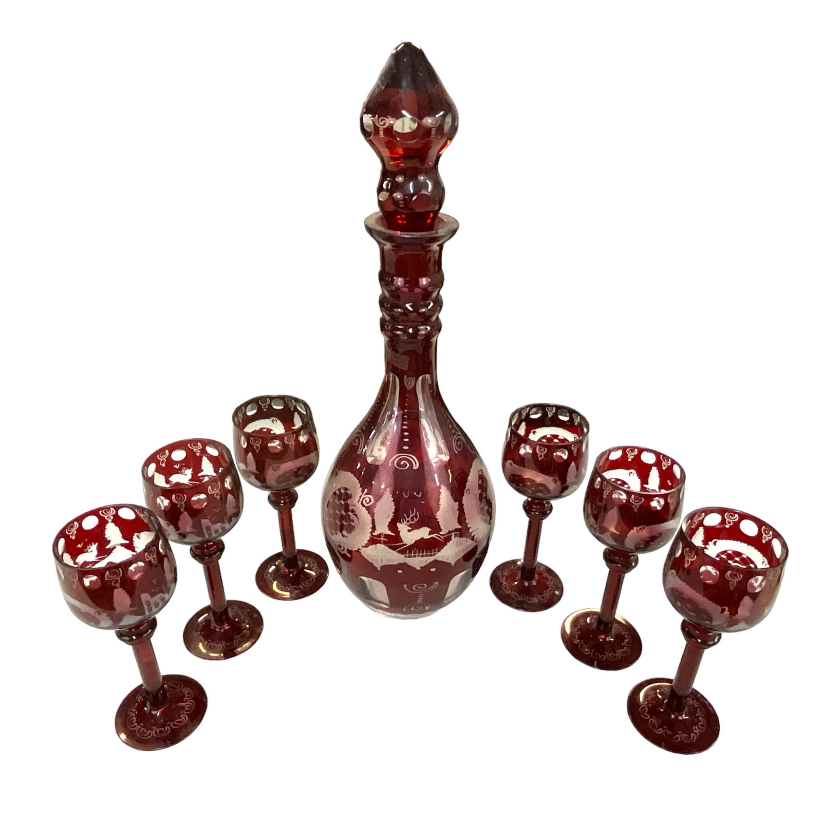 Bohemian Cranberry Cut-to-Clear Decanter Set: Bohemian Cranberry Cut-to-Clear Decanter Set with 6 wine glasses. Decanter approx. 20" tall; glasses each approx. 8" tall.
