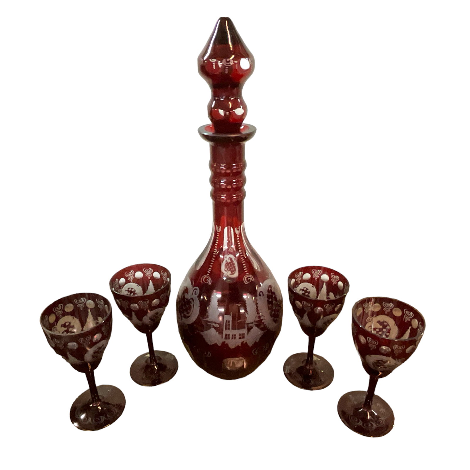 Bohemian Cranberry Cut-to-Clear Decanter Set: Bohemian Cranberry Cut-to-Clear Decanter Set with 4 wine glasses. Decanter approx. 20" tall; wine glasses approx. 7" tall.