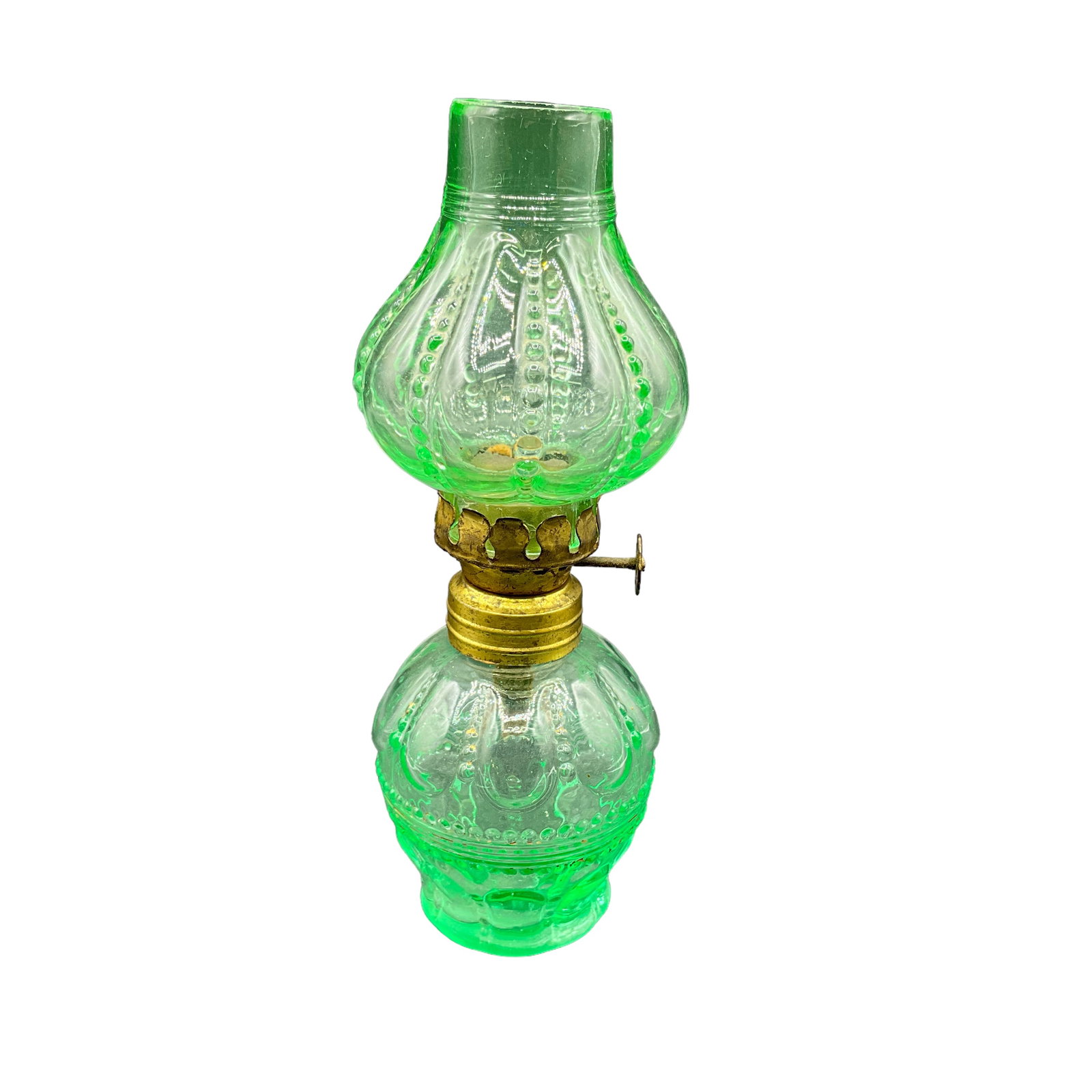 Miniature Victorian Oil Lamp, Embossed Green Glass: Embossed green glass oil lamp. Includes base, shade, and burner. Measures approx. 6 1/4" tall, 2 1/2" diameter.