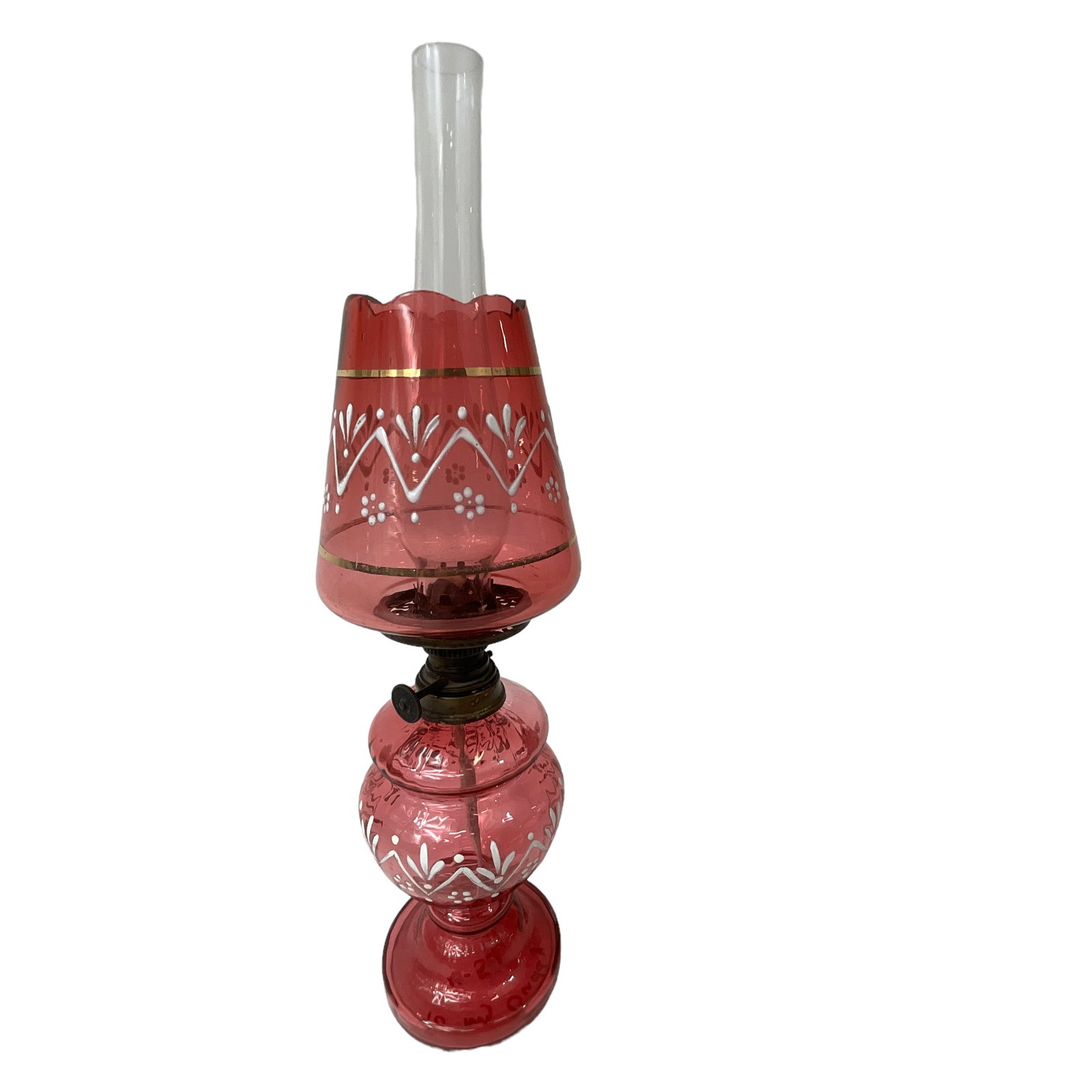 Miniature Victorian Oil Lamp, Cranberry Glass with White Enamel Floral Design: Cranberry glass oil lamp featuring painted white enamel floral design. Includes base, shade, chimney, and burner. Measures approx. 12" tall, 3 1/4" diameter