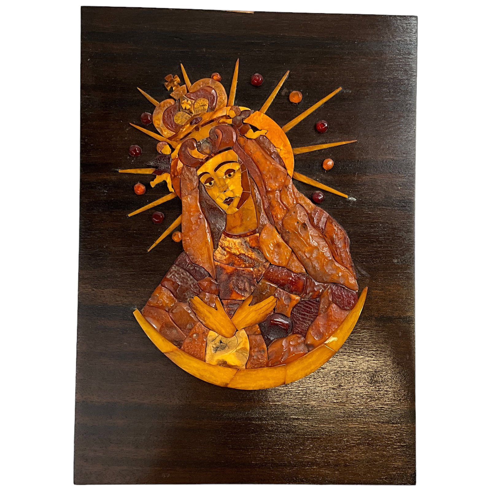 Madonna Mosaic on Mahogany Panel, Baltic Amber: Madonna mosaic of multi-color Baltic Amber on a mahogany wood panel. Measures approx. 17" x 12". Three "ray" tips are broken off.