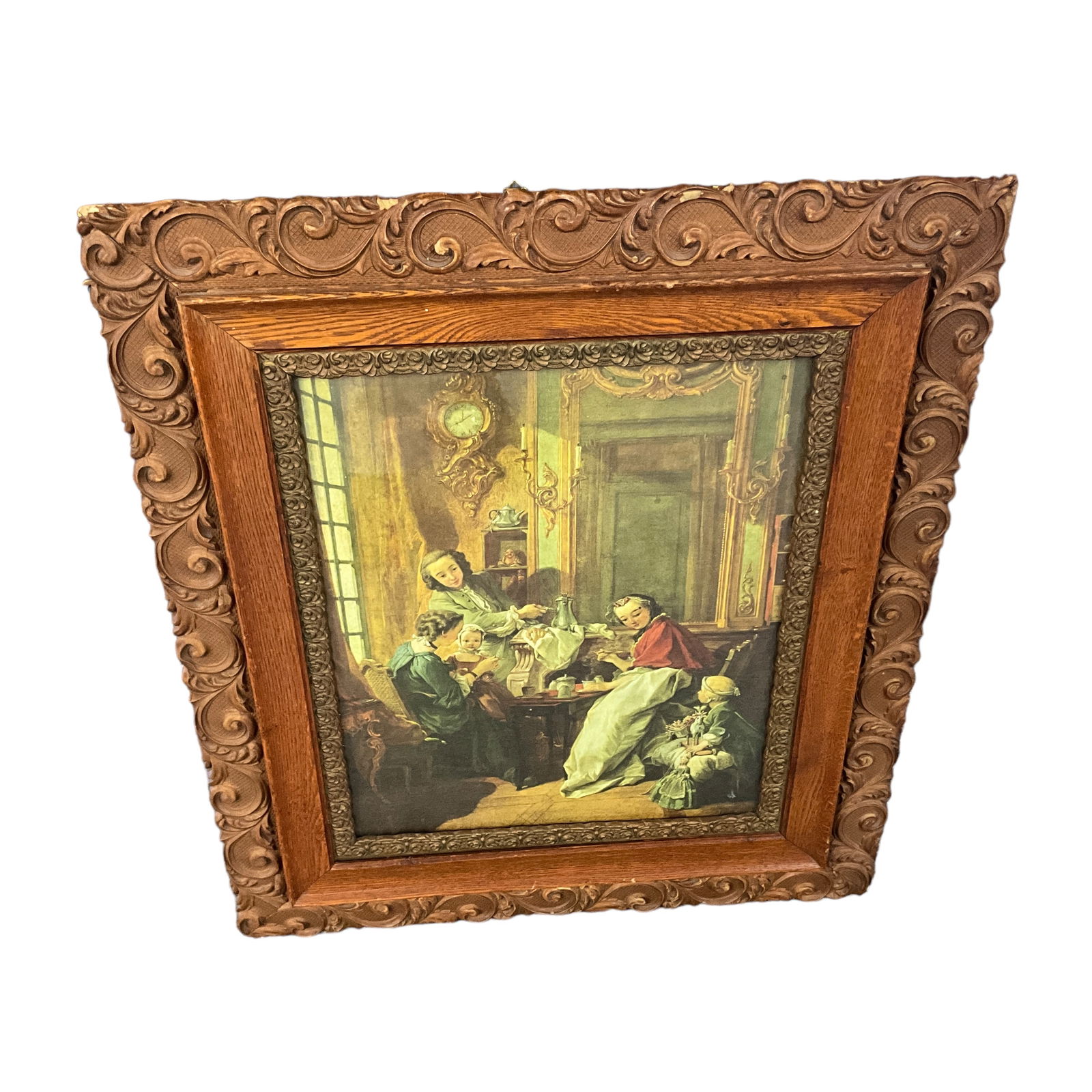 Dutch Family Scene in Victorian Frame: A lithograph of a Dutch or Victorian family scene, in a Victorian oak and plaster frame. Measures approx. 30" X 25.5" OA, and 19.5" X 15.25" SS.