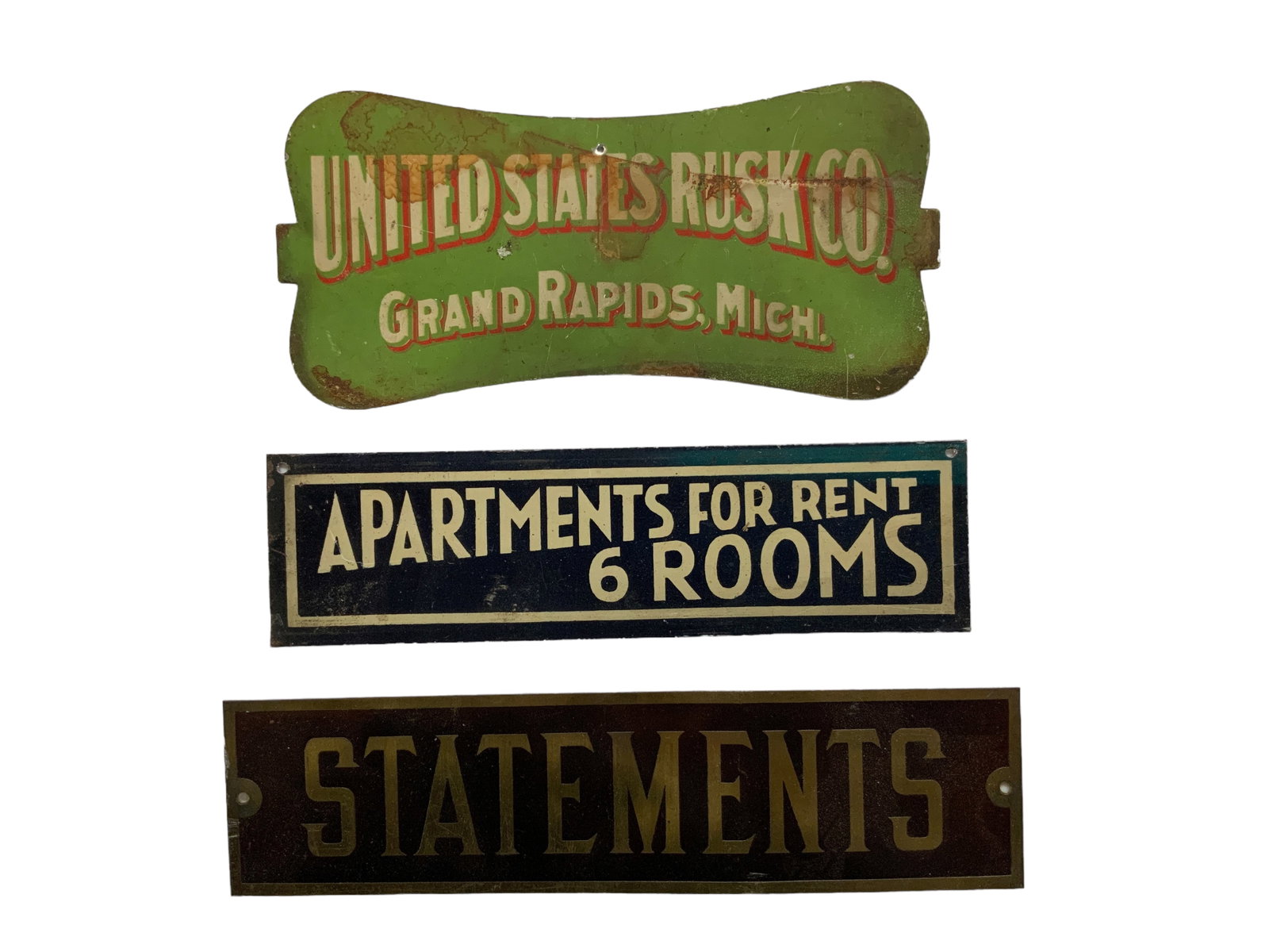 Vintage Metal Signs, Lot of 3: Vintage metal signs including United States Rusk Co (Grand Rapids, Mich), "Statements", and Apartments for rent, lot of 3. Rusk Co sign measures approx. 8 1/4" long, 4" tall and has water stains.