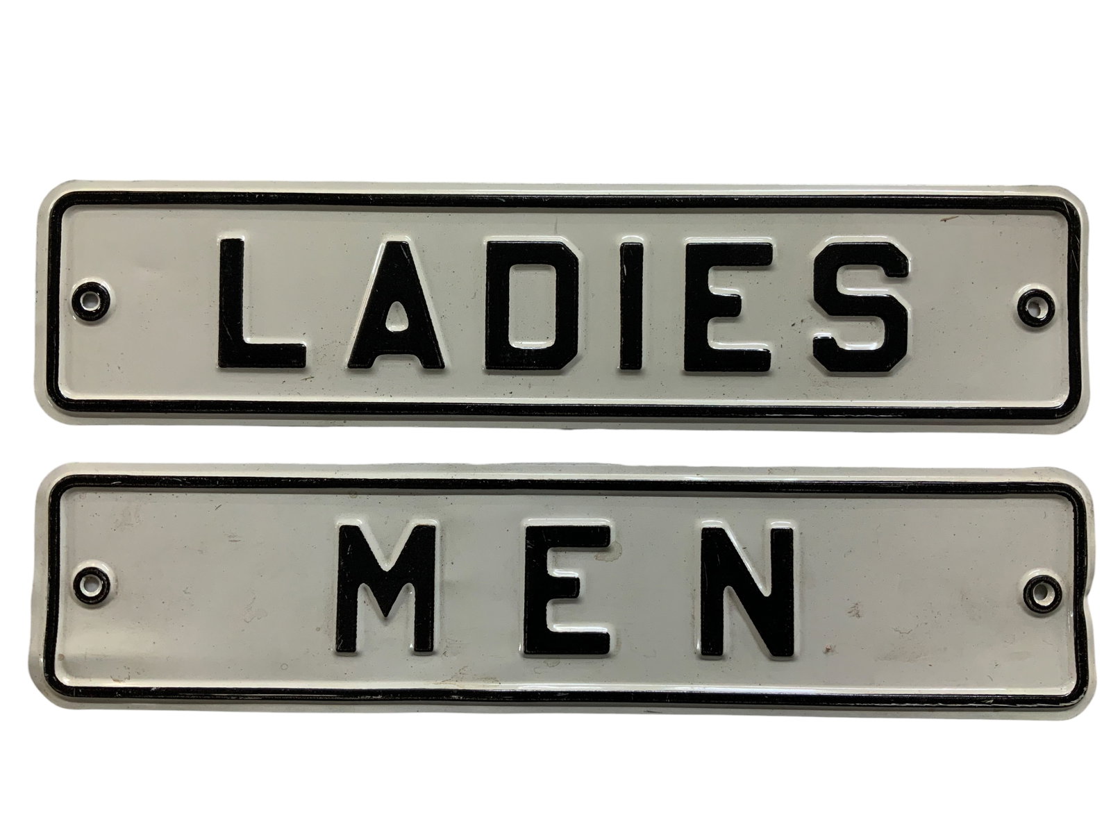 Vintage Ladies/Men Restroom Signs, Matching Set: Set of black and white embossed aluminum metal each measures approximately 2 1/2" by 11" Exhibit some storage wear associated with age surface wear scratches, scuffs, dings, bows, etc.