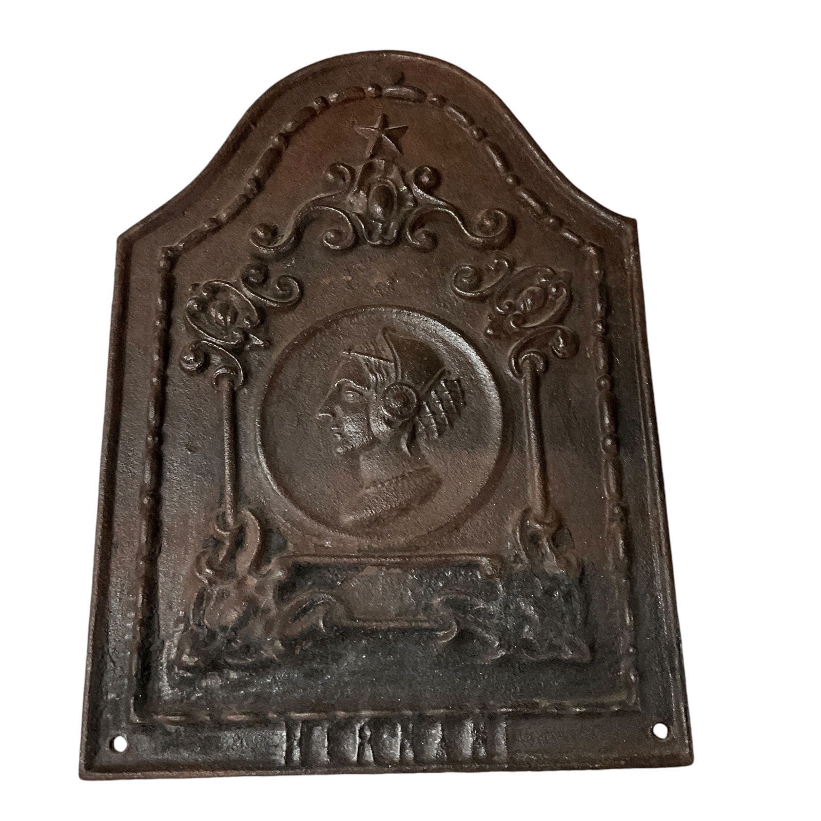 Cast Iron Fireback: Cast iron fireback, depicting a woman in profile, inside a scrolled frame. Fireback measures approx. 14" X190" X 1", and weighs 20 Lbs, 5 Oz. Note- Heavy, Bulky item- excess freight charges will apply