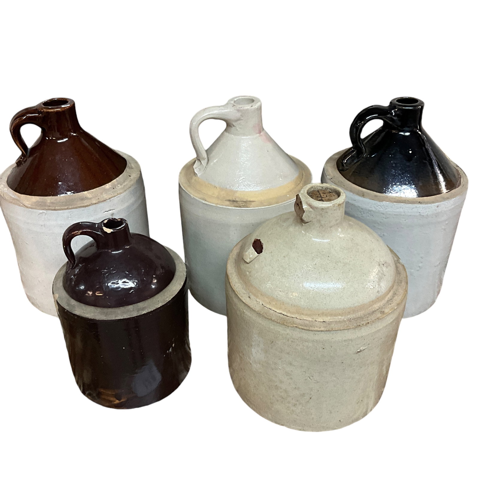 Lot of 6 Stoneware Jugs: Lot of 6 Stoneware Jugs, of various sizes. Smallest measures approx. 8.5" tall; largest is approx. 13" NOTE- Heavy/Bulky item- excess freight charges will apply.