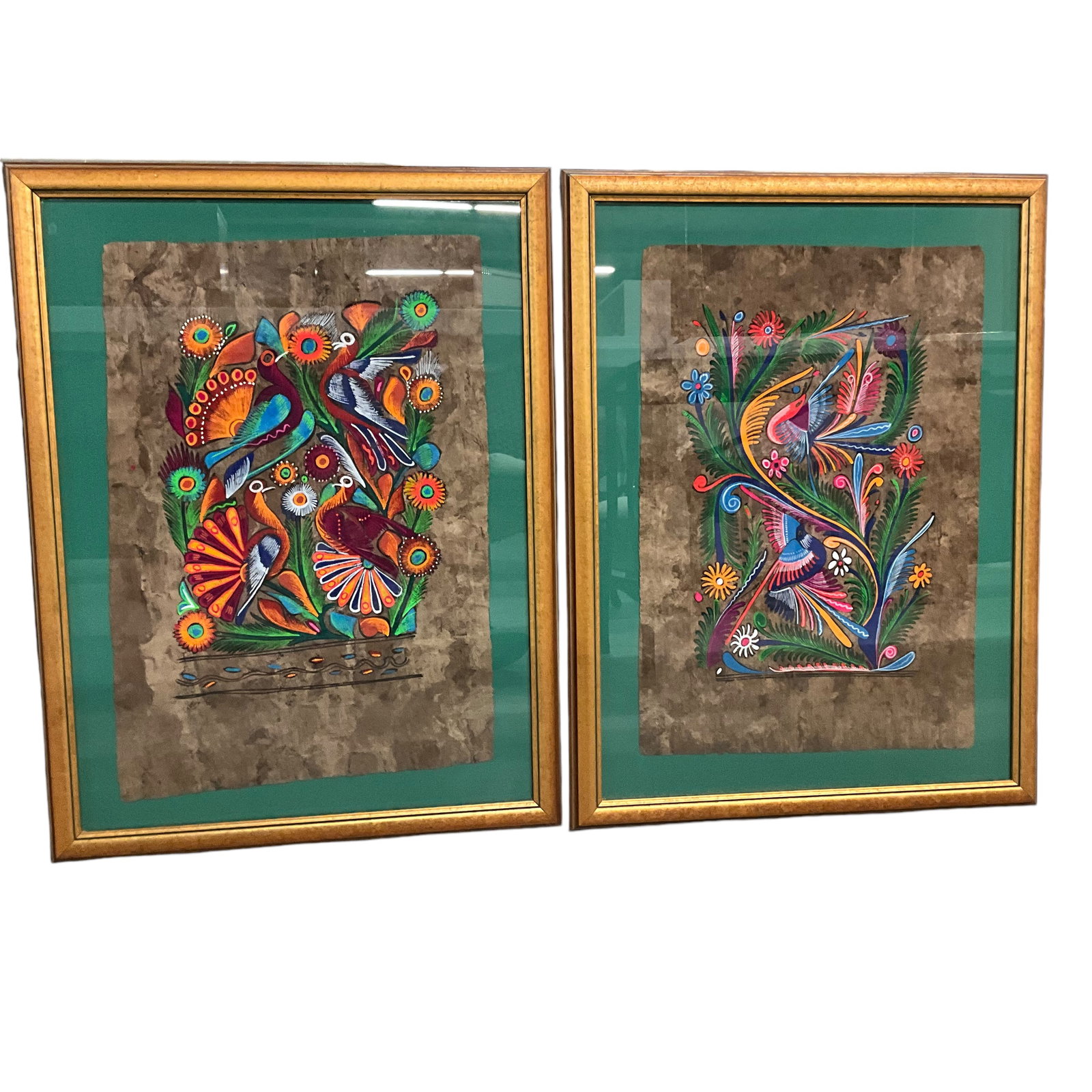 Pair of Colorful Indonesian Folk Art Paintings: Pair of Colorful Indonesian Folk Art Paintings, on hand-made paper. Approx. 29.5" X 22.25" OA, and 23" X 15" SS. Paintings have not been removed from frames for examination.