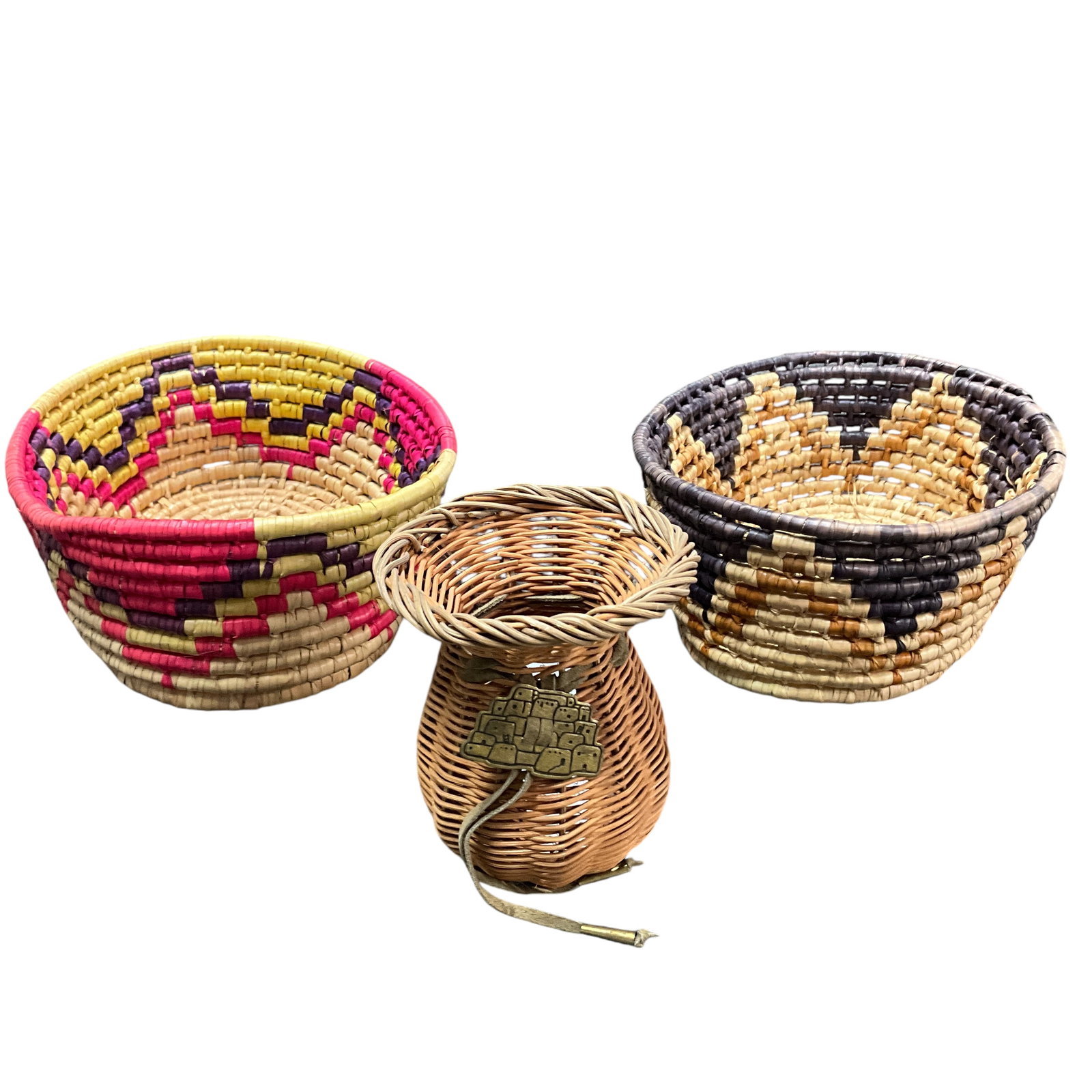 Trio of Native American Baskets: Trio of Native American Baskets- Two oval, and an urn shaped basket. The oval baskets are vintage, the urn basket is new old stock. Largets basket measures approx. 10.75" X 8.25" X 3.5". The urn baske