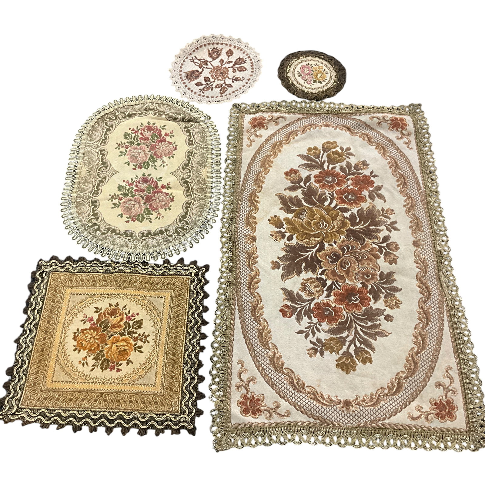 Embroidered Doilies or Table Runners: Group of 5 embroidered doilies or table runners. Smallest is approx. 5" in diameter; largest measures approx. 13" X 22"