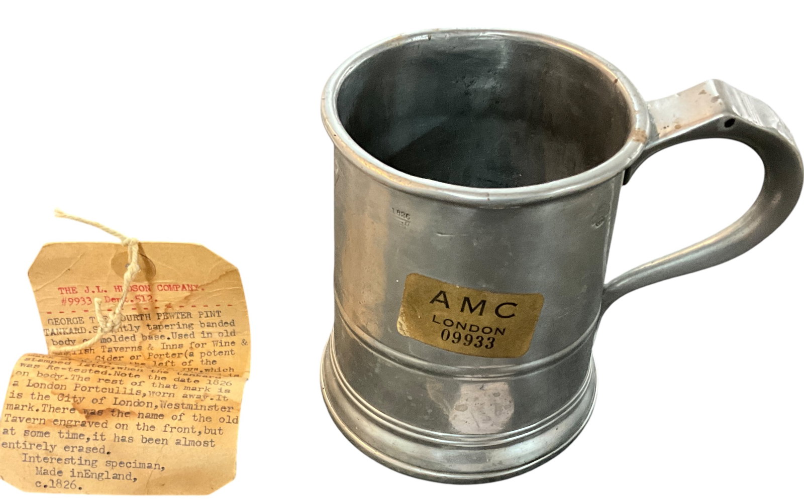 George IV Hallmarked Pewter Pint Tankard: George IV Hallmarked Pewter Pint Tankard, Circa 1826. Includes tag from the J. L. Hudson Company, describing the markings on the tankard, and their meaning. Approx. 4.5" tall, and 4" diameter. An unus