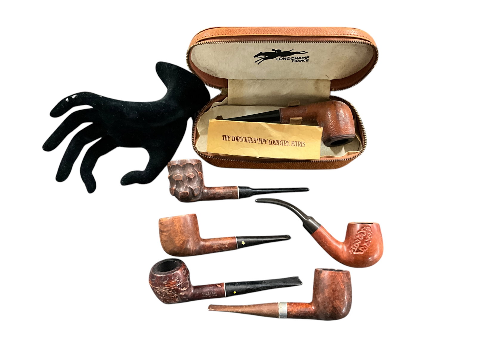 Group of Six Wooden/Briar Smoking Pipes: Group of Six Wooden/Briar Smoking Pipes, including a leather covered French Longchamp pipe in a leather case, with paperwork. Approx. 5" to 7" long.