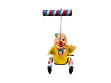 Lithographed Tin, Plastic, and Cloth Wind-up Clown