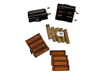 Two "Rollmonica" Player Harmonicas, with 15 Music Rolls