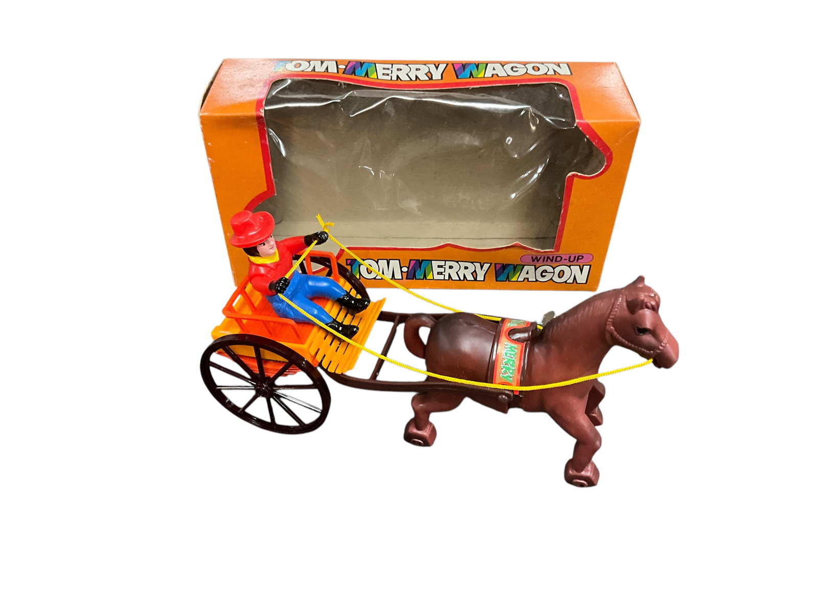 Plastic Wind-Up "Tom Merry Wagon": Plastic Wind-Up "Tom Merry Wagon" From Korea, in original box. Approx. 8" long.