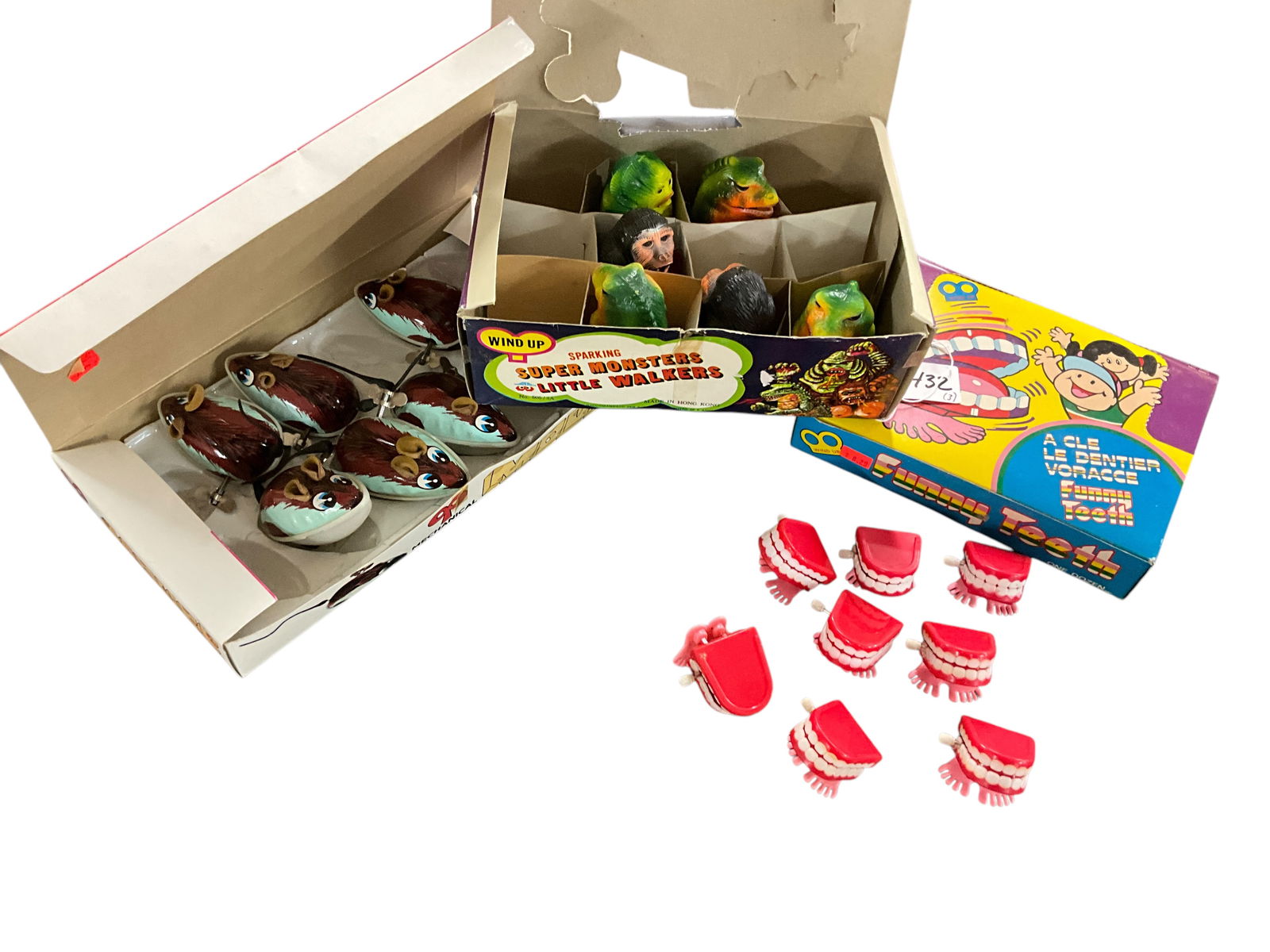Three Toy Displays of Wind-Up Toys: Three Toy Displays of Wind-Up Toys- Monster pack with 4 Godzillas and 1 King Kong, Mouse pack with 6 wind-up mice, and the Teeth pack with 8 sets of walking, chattering teeth.