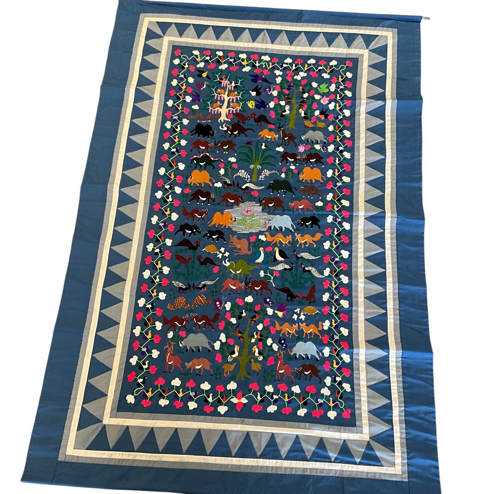 Embroidered Animal Wall Hanging: Embroidered Animal Wall Hanging. Fanciful embroidered wall hanging of numerous animals, including dinosaurs. Measures approx. 52" high and 36" wide.