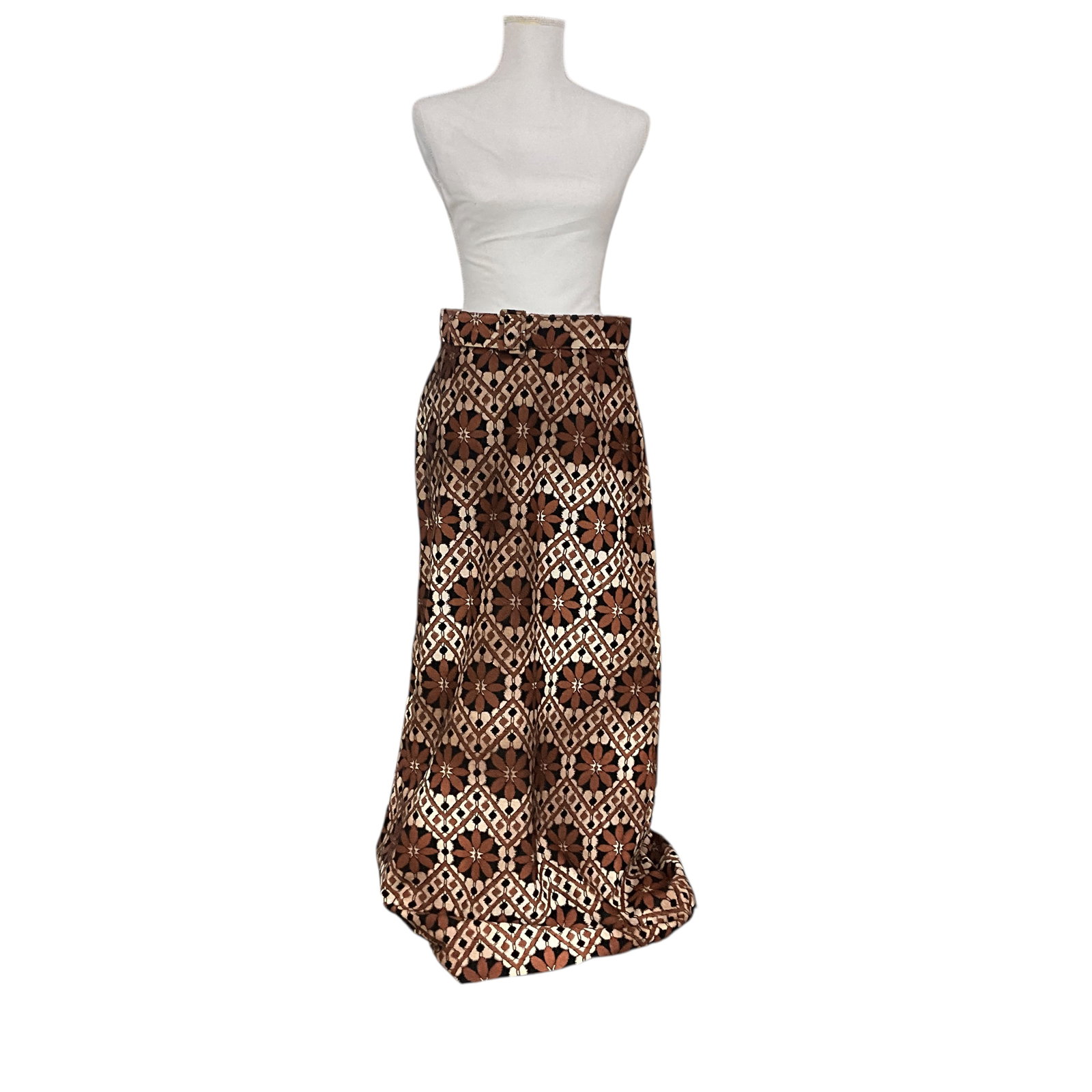 Nelly de Grab 1970's Maxi-Skirt: Nelly de Grab 1970's Maxi-Skirt. Earth tone knit with overall floral geometric pattern, lined in peach satin. Side zip, with belt, appears to be small or medium.