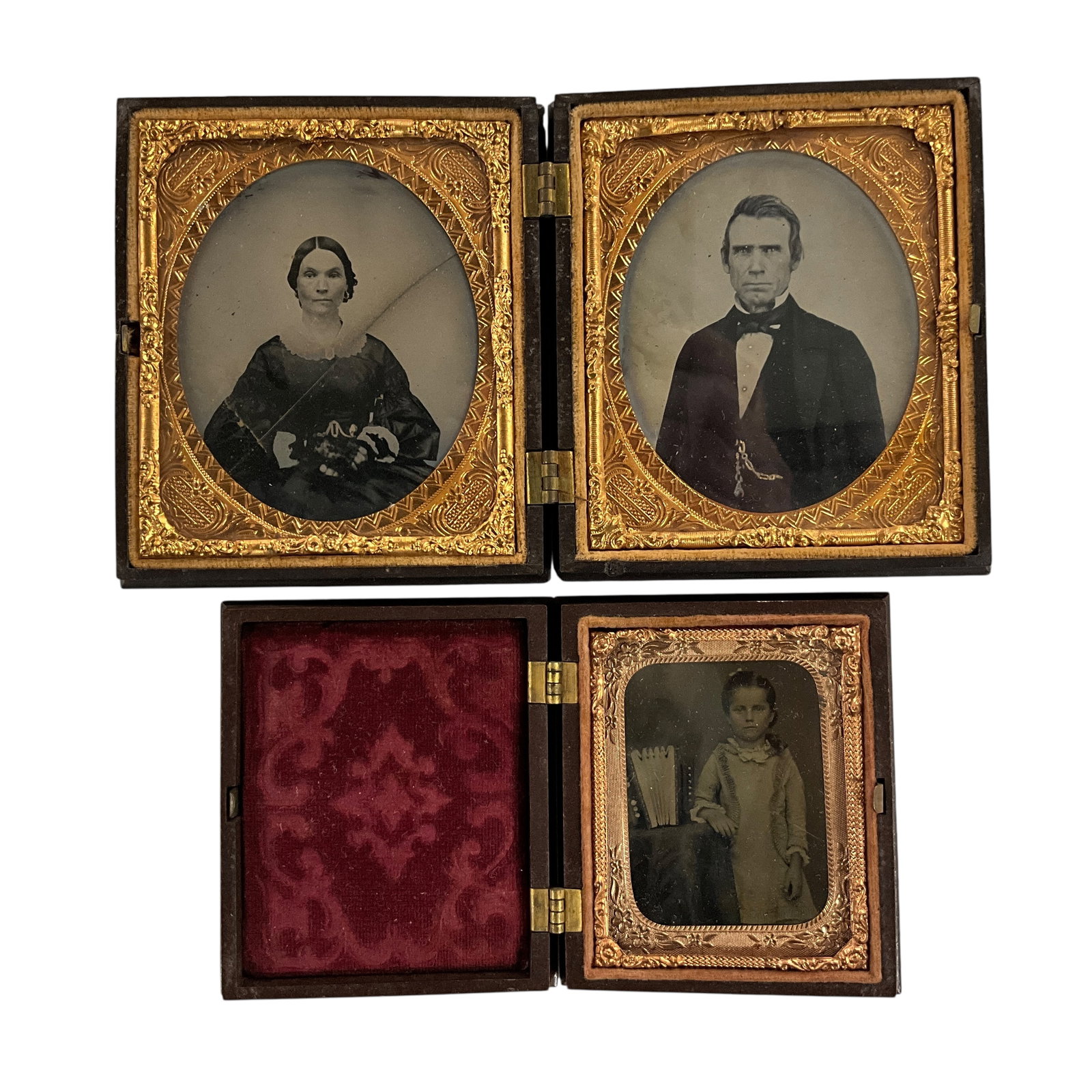 Pair of Mid 19th Century Cased Photographs: Pair of Mid 19th Century Cased Photographs. A double portrait of a middle aged couple in a gutta percha case- these appear to be ambrotypes, and the photo of the lady has a diagonal crack across the i