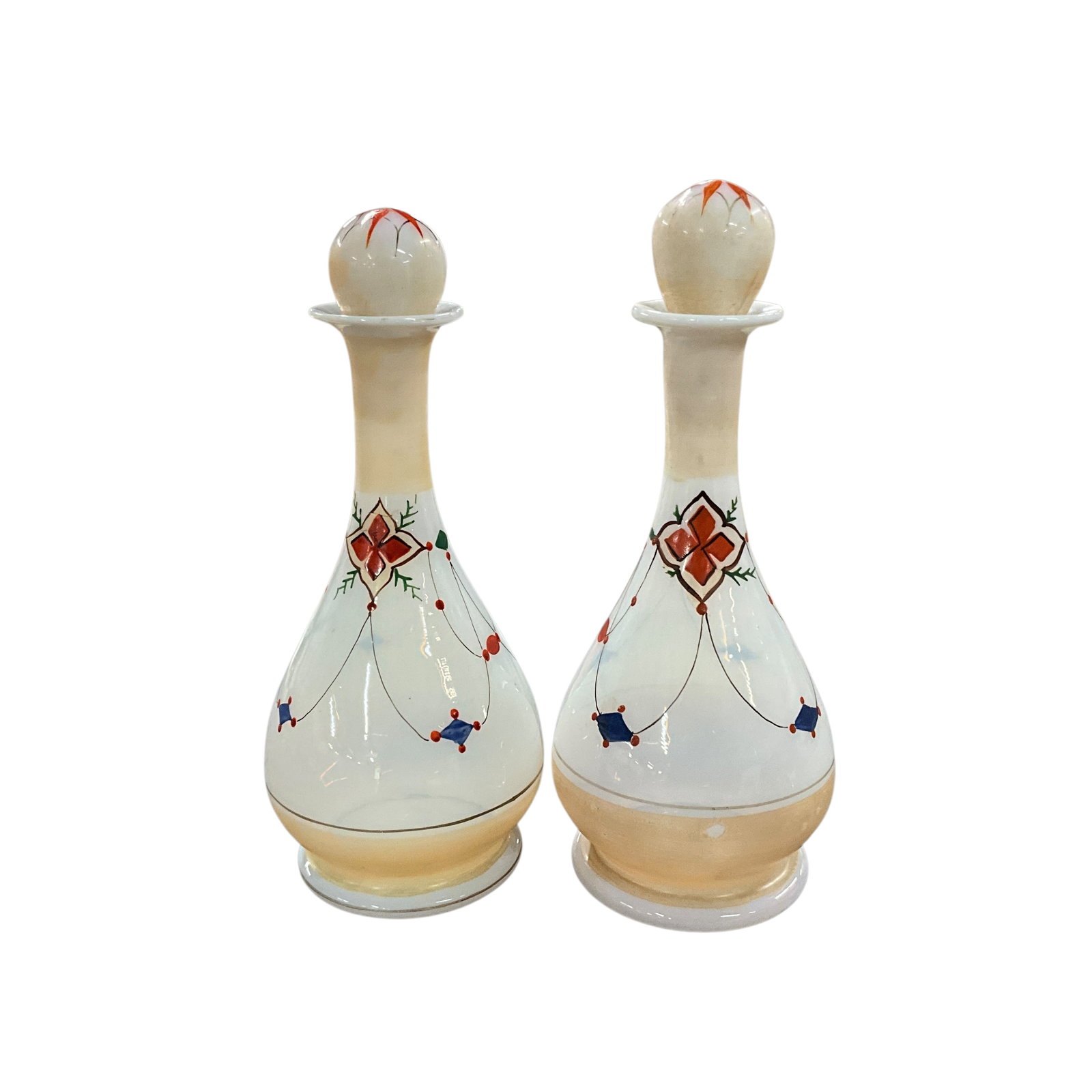 Pair Hand-Painted Bohemian Bottles: A lovely pair of antique opaline glass bottles with stoppers. Semi opaque glass, featuring hand painted, delicate design. Opaline glass, a type of antique glassware, originated in 19th century France 