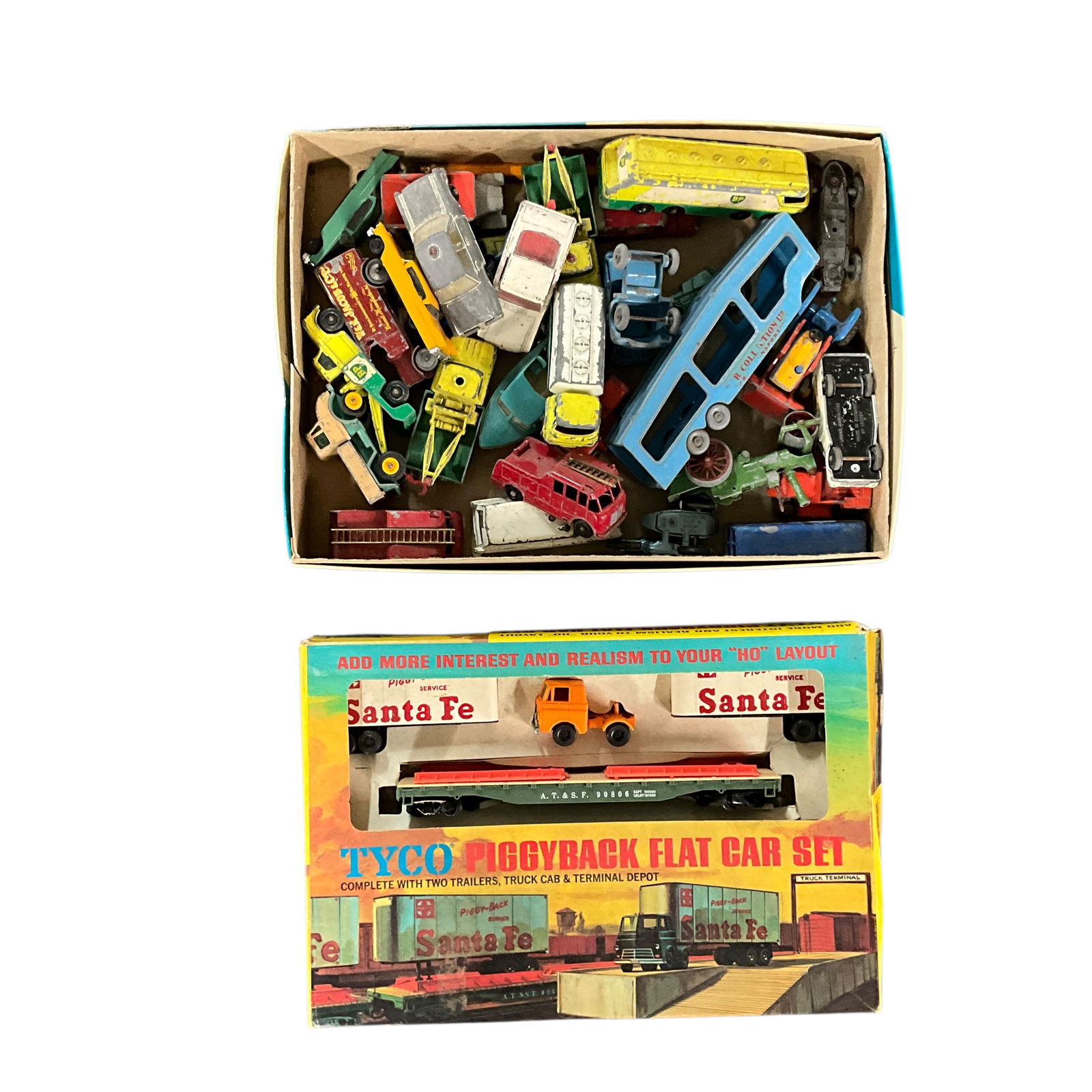 Lesney/Matchbox Diecast Vehicles, Tyco Piggyback Flatcar in original Box: Lesney/Matchbox Diecast Vehicles, Tyco HO Scale Piggyback Flatcar in original Box. 30+ Lesney/Matchbox vehicles in well played with condition.