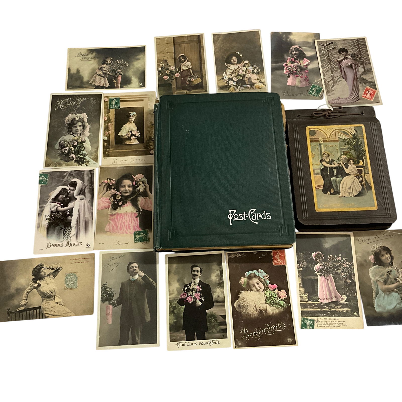 Two Postcard Books, Plus Loose Cards: Two Postcard Books, Loose Cards. One book has about 40 pages, two sided, two per page, and the other has about 15 pages, two sided, one per page, plus some loose cards. There is also a packet of Frenc