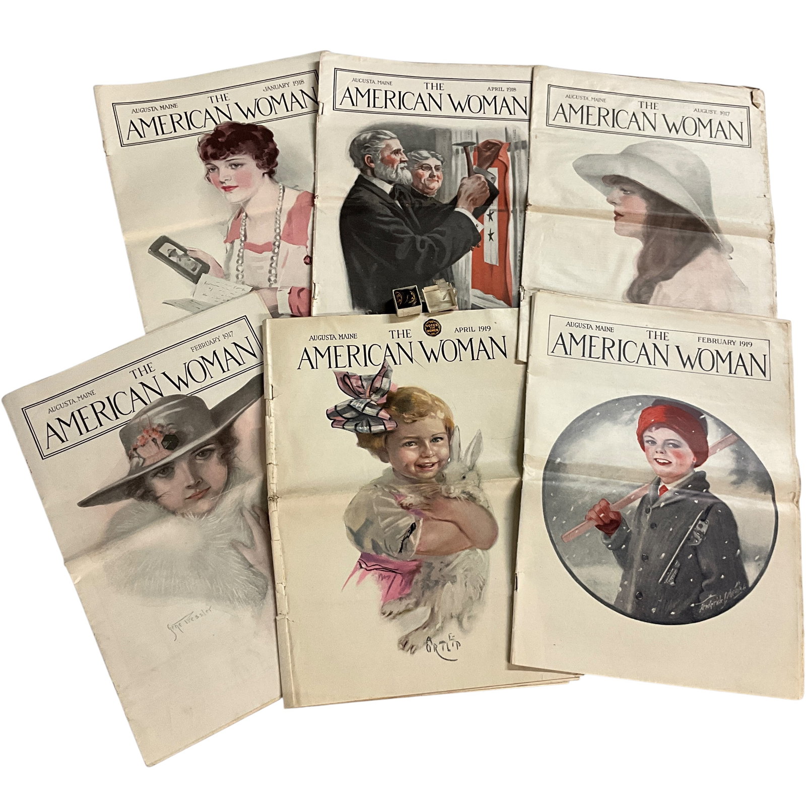 The American Woman Magazines, "Votes for Women" Stickers: The American Woman Magazines, "Votes for Women" Stickers. Six issues of The American Woman magazine, 1917 to 1919, along with a stack of tiny (< 1") "Votes for Women" gummed stickers.