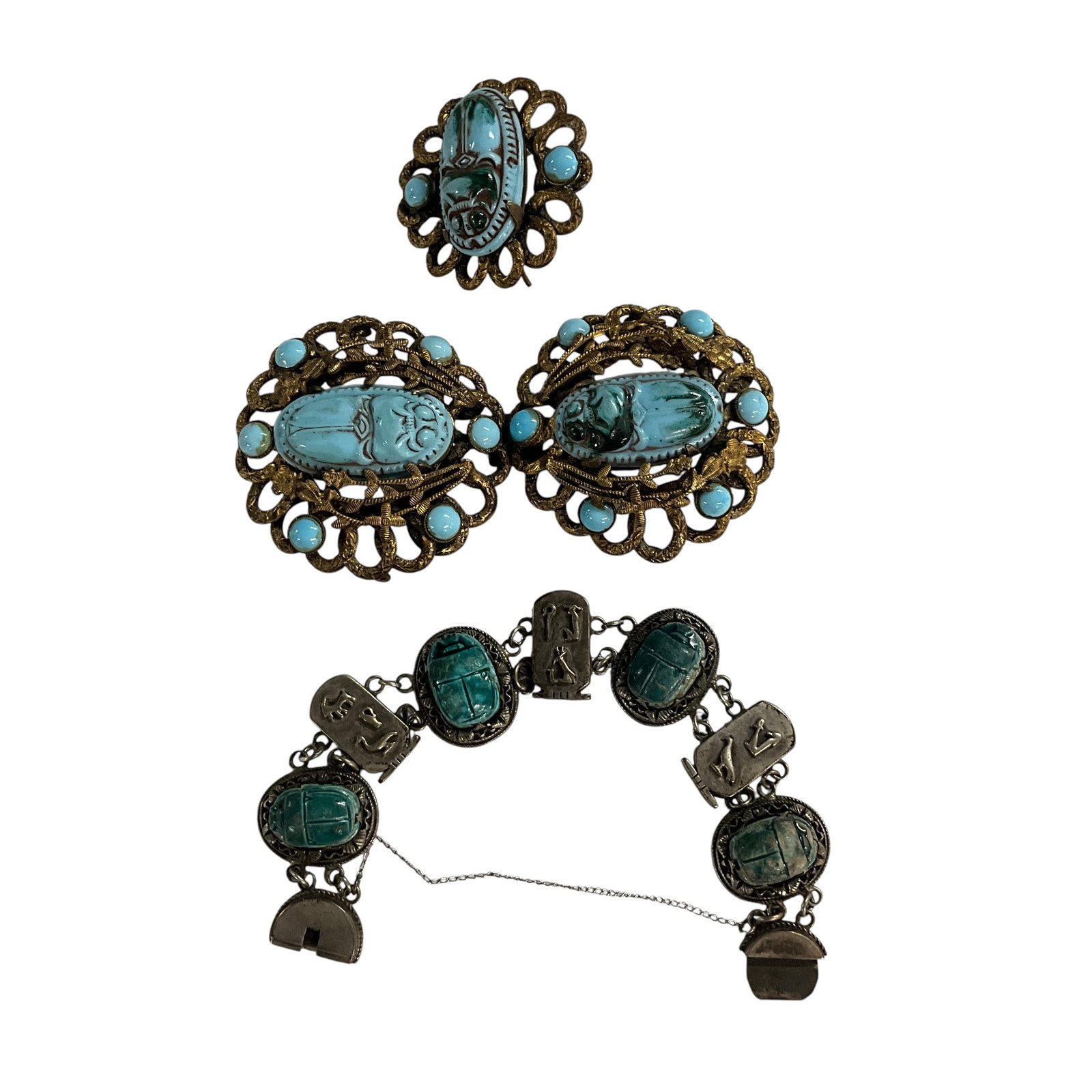 Egyptian Revival Scarab Jewelry: Egyptian Revival Scarab Jewelry. A bracelet with four carved scarabs, alternating with hieroglyphic cartouches, and a two piece belt buckle with a medallion which was likely mounted on the belt. Belt 