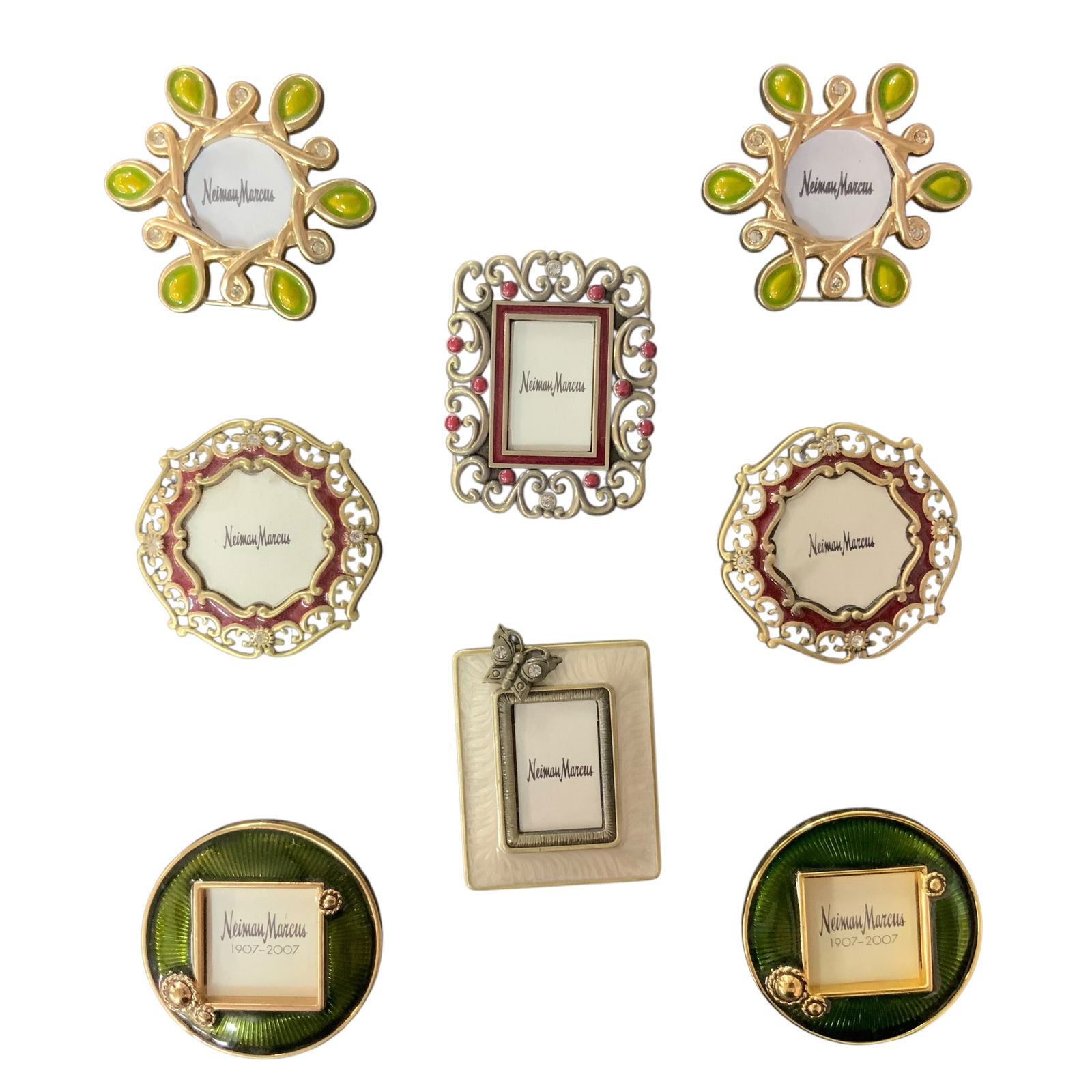 Jay Strongwater for Neiman Marcus mini frames: This elegant set of eight Jay Strongwater mini picture frames is perfect for showcasing cherished memories. Each frame features intricate detailing and a unique design, highlighting the craftsmanship