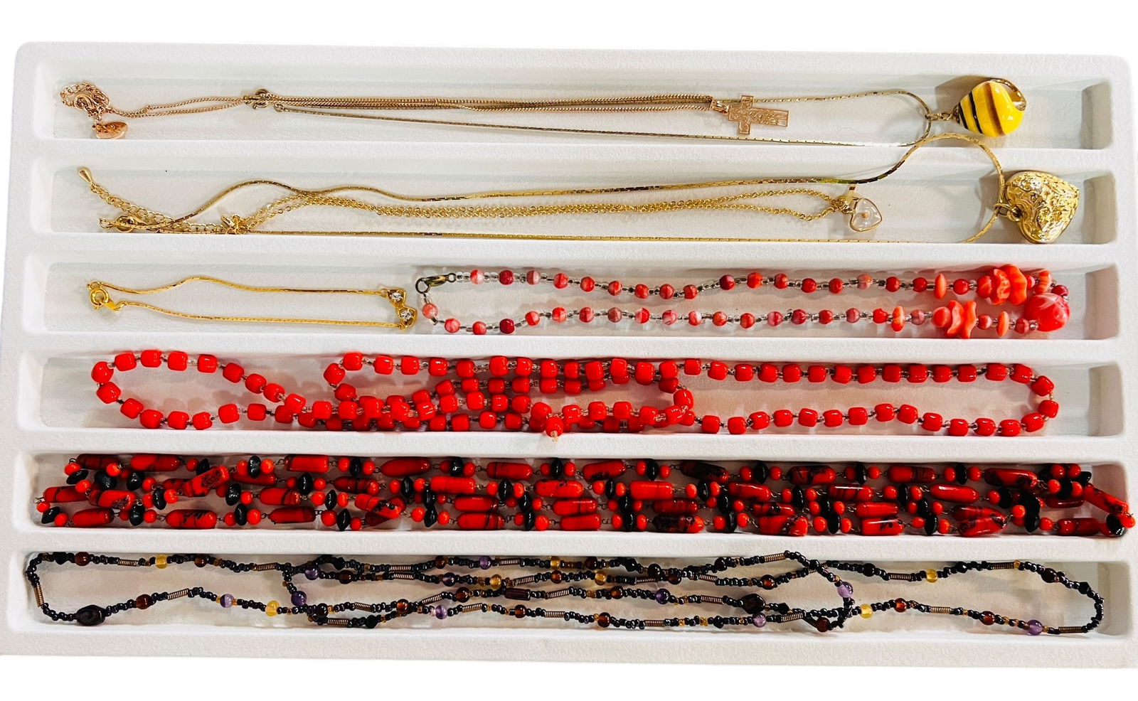 Vintage Necklace Collection: Beaded 1970's necklace with pink and black swirl beads, hangs flapper length at 27 inches. Pretty red and clear bead necklace hangs 17 inches. Purple bead and copper wire necklace, hangs 20 inches. Pi