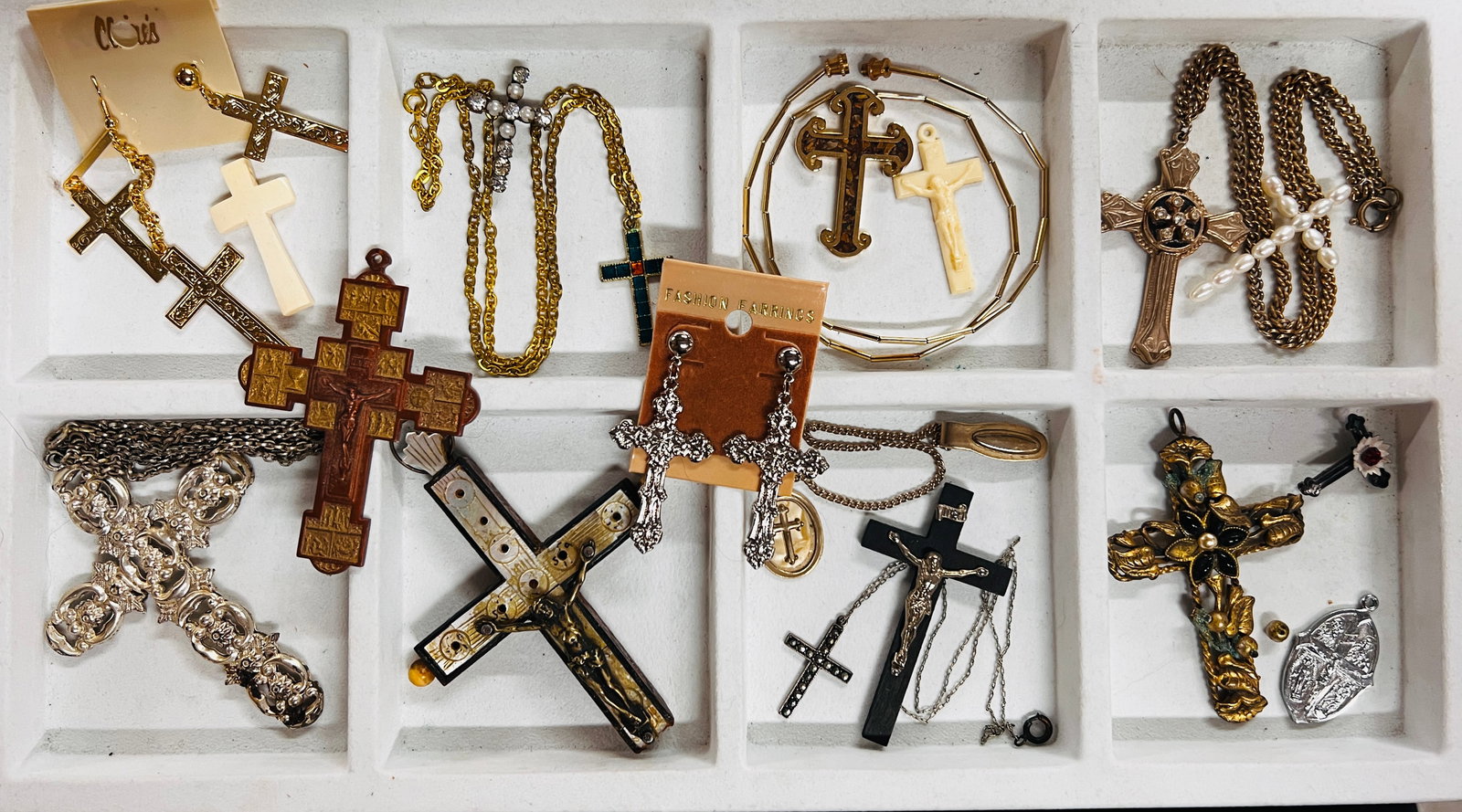 Crosses & Crucifixes: An eclectic collection of crosses & crucifixes. There are diverse styles, a range of designs from antique pieces with intricate details, to simpler more contemporary styles. Various materials are used