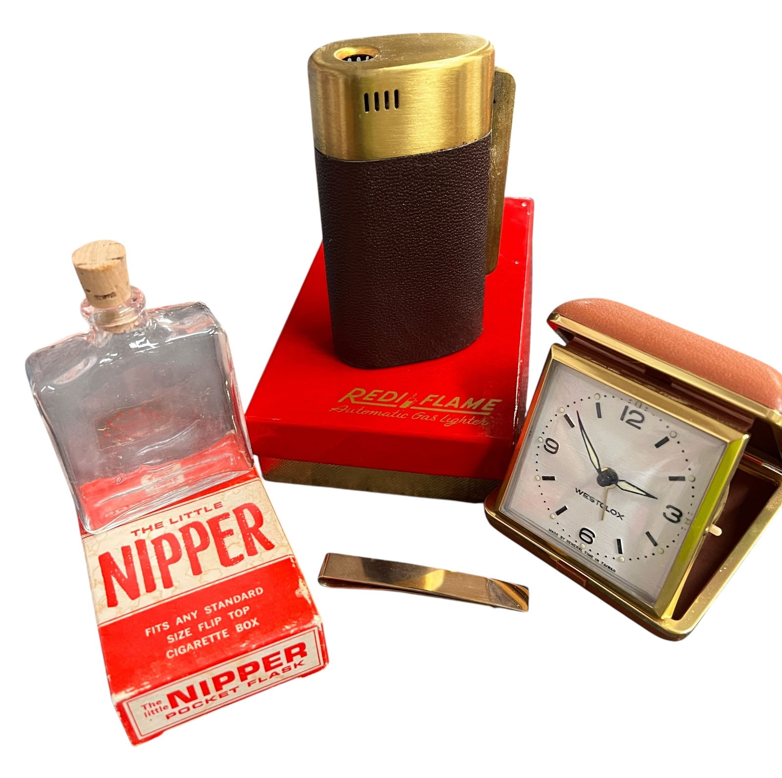 Fun Collection of Vintage Mens Accessories: Travel clock, sneaky glass flask, tie clip and very cool Redi Flame table lighter. Lighter is very unique and uses LP gas cartridges.