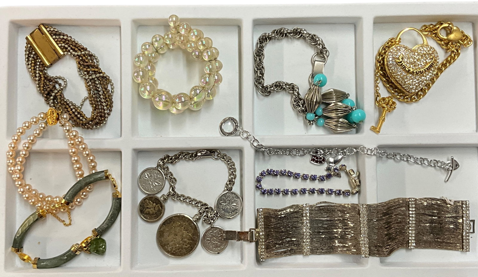 Vintage Jewelry-Bracelets: Ten vintage bracelets of various design, materials and eras. The coins in the charm bracelet are genuine.See photos for details and condition.