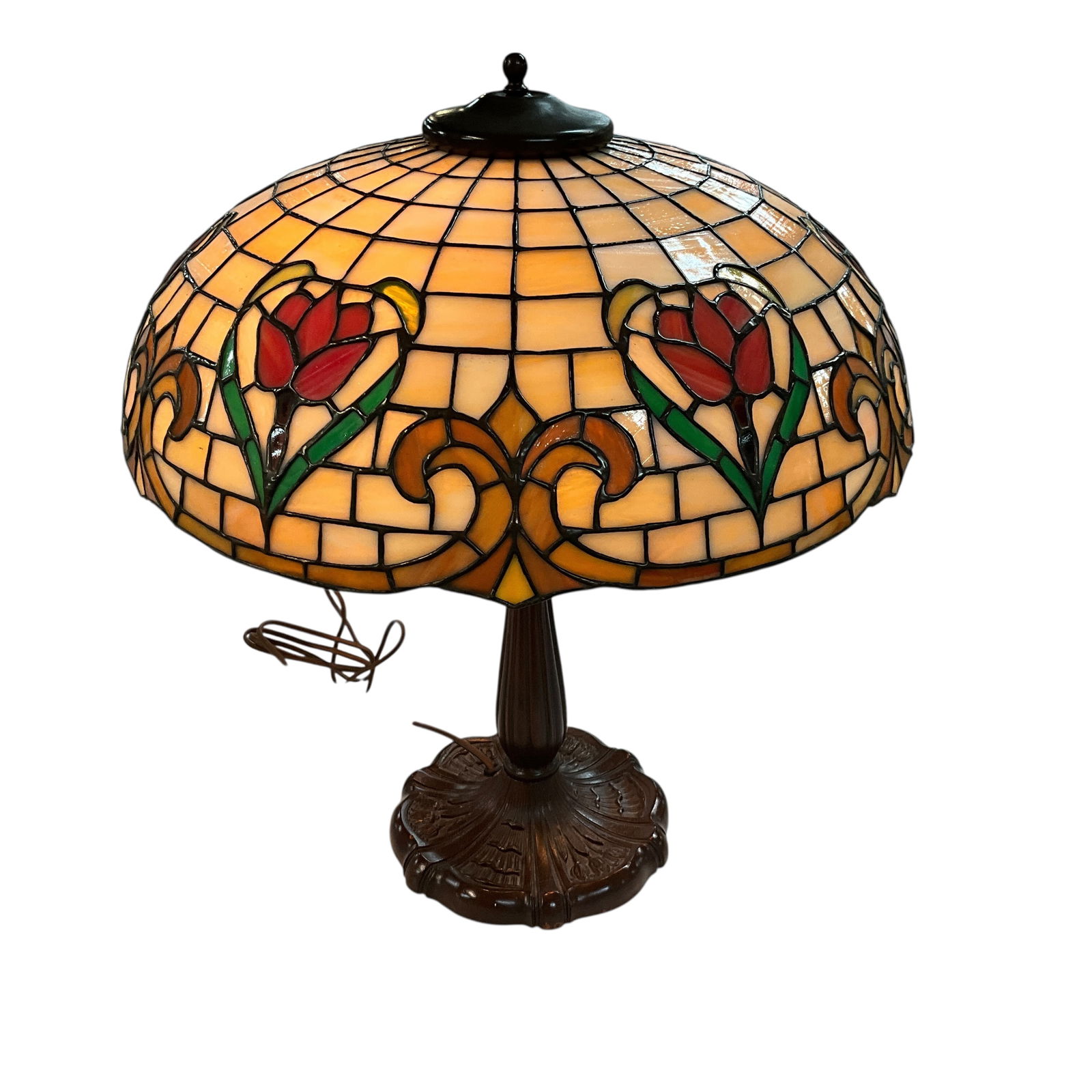 Beautiful Stained Glass Lamp with Tulip Motif: Beautiful Stained Glass Lamp with Tulip Motif. 18" diameter leaded glass shade, 6.5" high. Base is 8.5" in diameter, with embossed tulips, and stands approx. 21" high. Double socket with chain pulls.