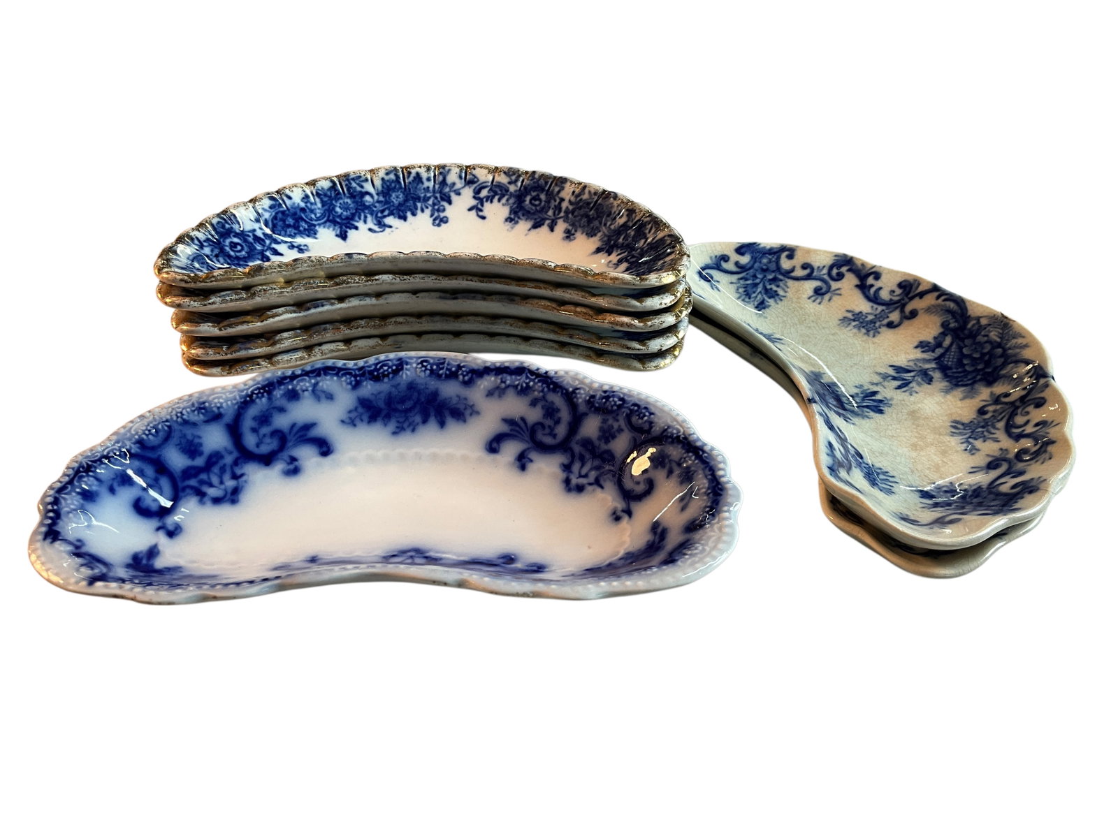 Group of Flow Blue Bone Dishes: Group of Flow Blue Bone Dishes. Eight dishes in three patterns- Five Rhoda, two Royal, and one we can't make out.