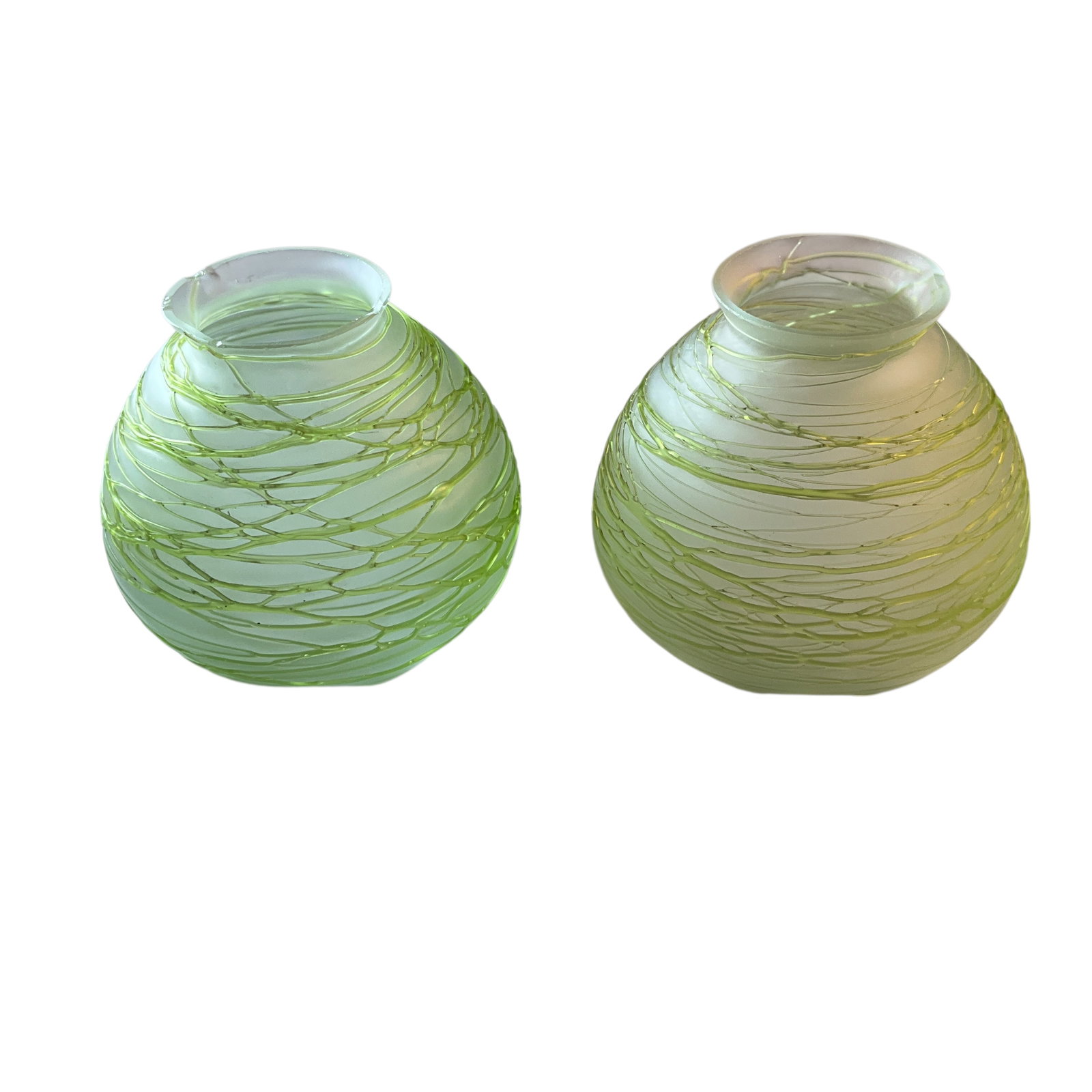 Pair of Loetz Style Art Glass Shades: Pair of Loetz Style Art Glass Shades, with glass string overlay in shades of green. 2.25" fitter, approx. 2.5" high. One shade has a couple of chips on the fitter rim, but there are no chips or cracks