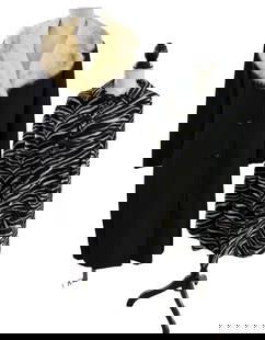 Pair of Vintage Fur Outerwear: Long black Youthcraft overcoat with fur trim. Faux fur cape in a fun zebra print. Cape is reversible, with solid black as the underside.